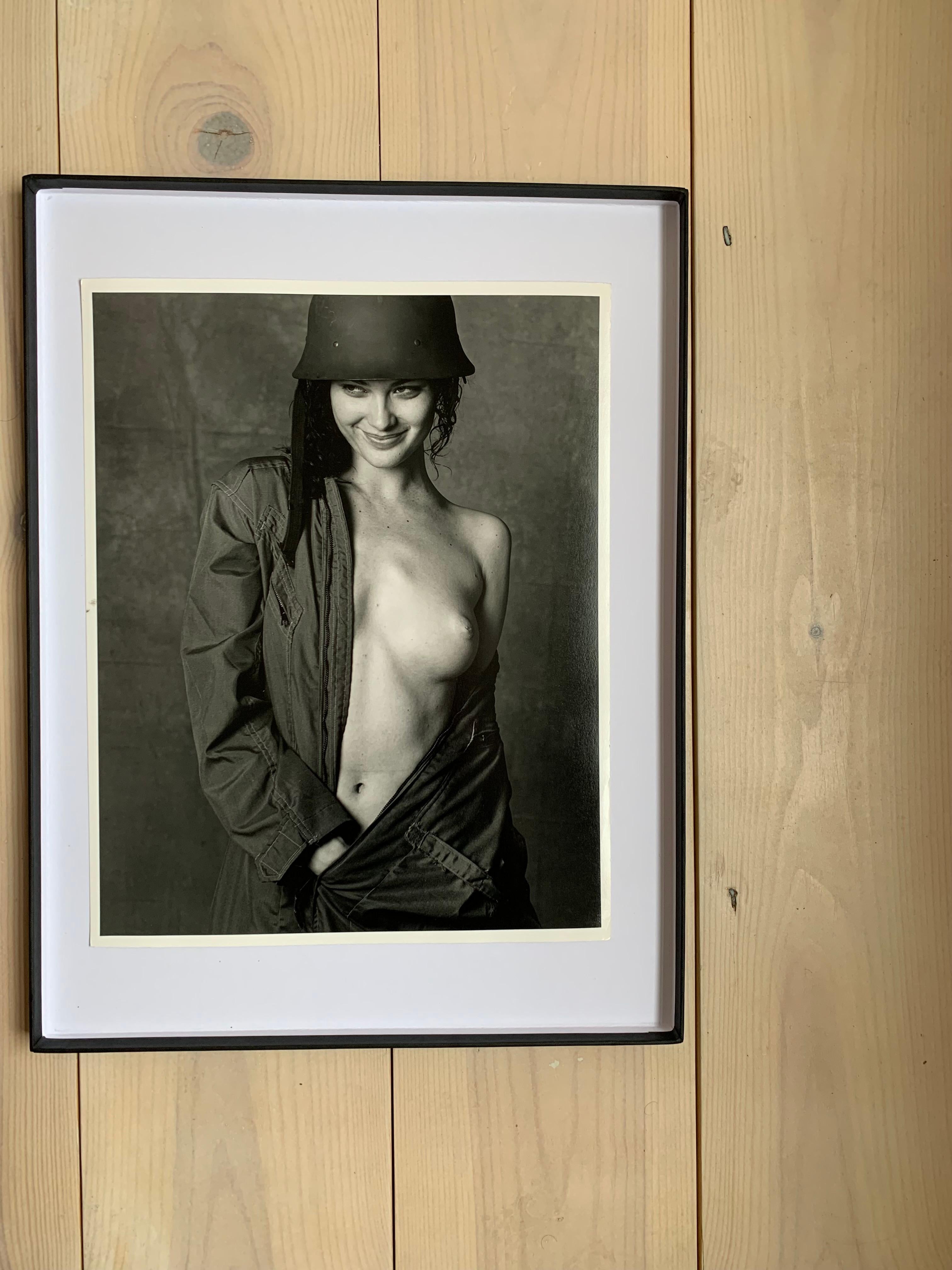 Shalom Harlow - Nude in army outfit - for the 1998 Pirelli Cal, Model portrait - Black Black and White Photograph by Bruce Weber