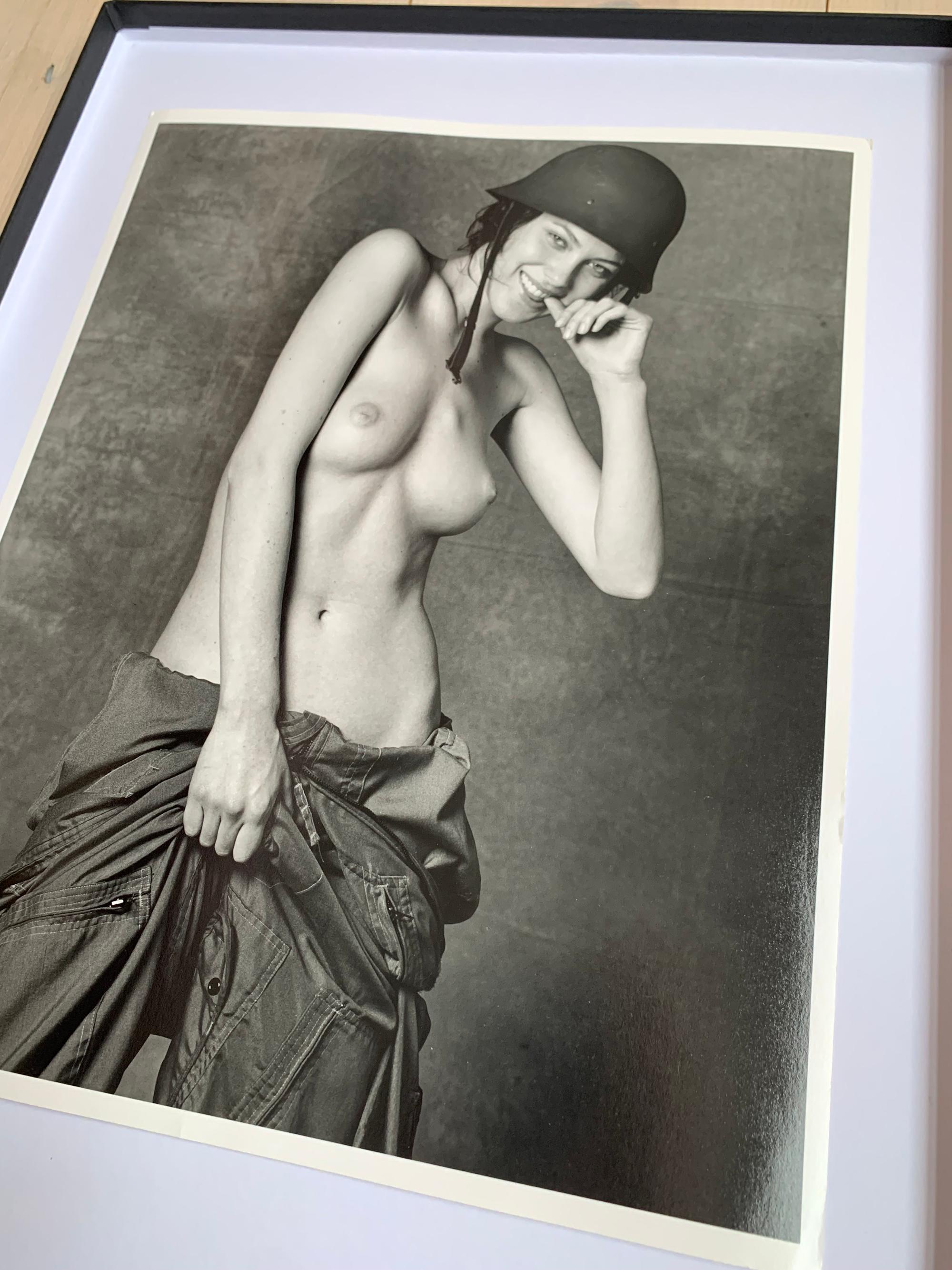 Shalom Harlow; Topless in army outfit - Pirelli session (1997) for 1998 - Photograph by Bruce Weber