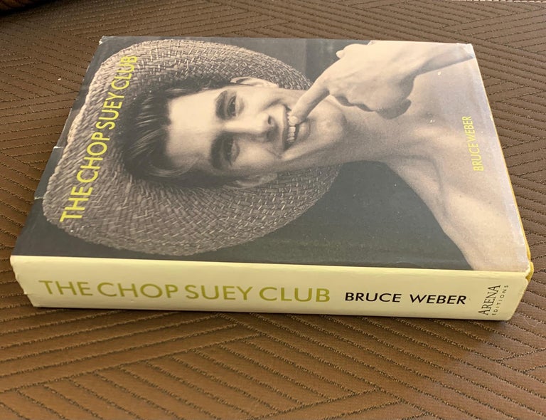 Rare, Bruce Weber signed 1st edition of The Chop Suey Club. See attached suite for signature and note. Quite rare, indeed. Minor tears on paper cover, not on hardcover.