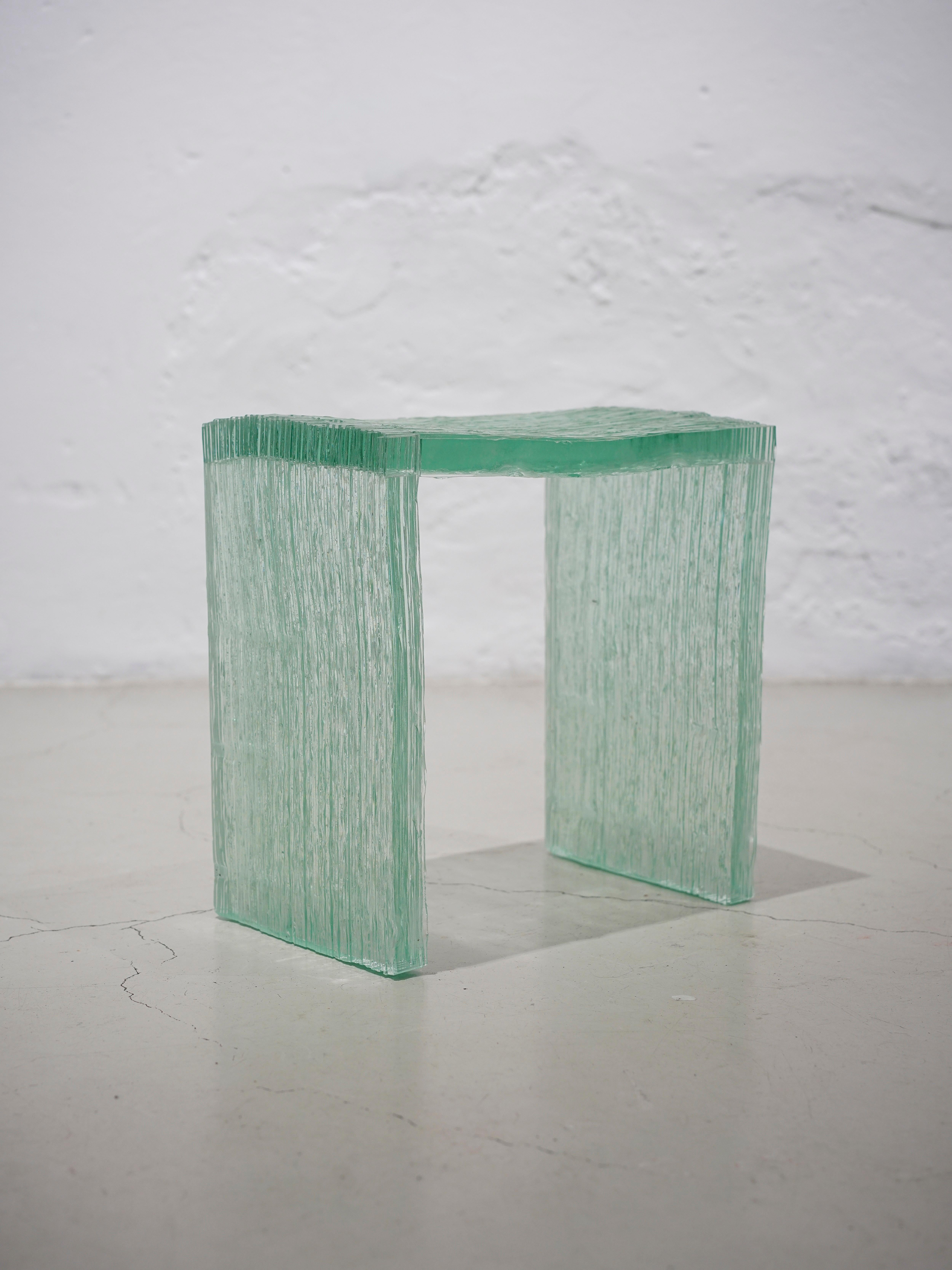 Bruch glass stool by Anima Ona
Dimensions: D 40 x W 40 x H 40 cm
Materials: glass

Bruch is made out of sheet glass which has been broken into stripes and melted together again.

anima ona is a design studio established in 2018 by Freia