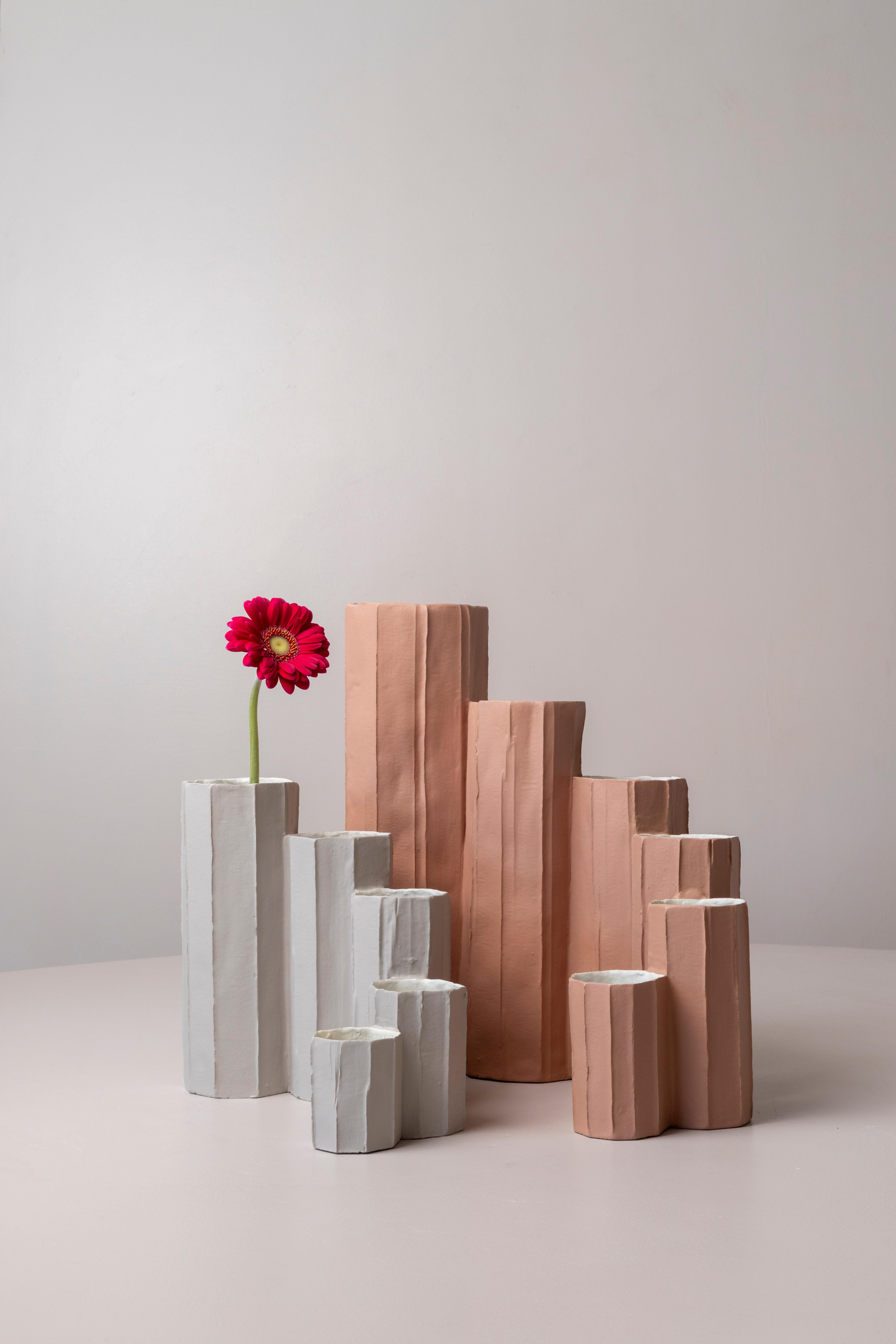 Bruco is one of the latest collections of Paola, inspired by nature, translating organic forms into a dynamic composition. Volumes of varying heights and diameters create a sinuous rhythm, playing with light, shadow, and texture. The design evokes