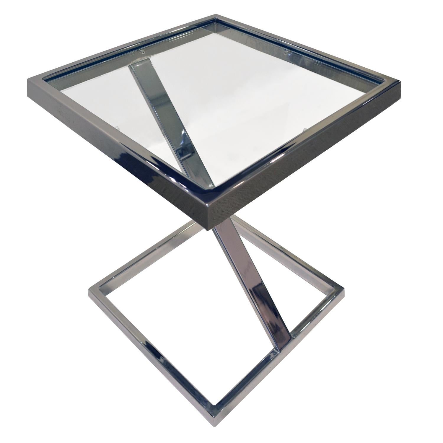 Cantilevered side table in chrome with inset glass top by Brueton Industries, American, 1970s. This is a very cool design.