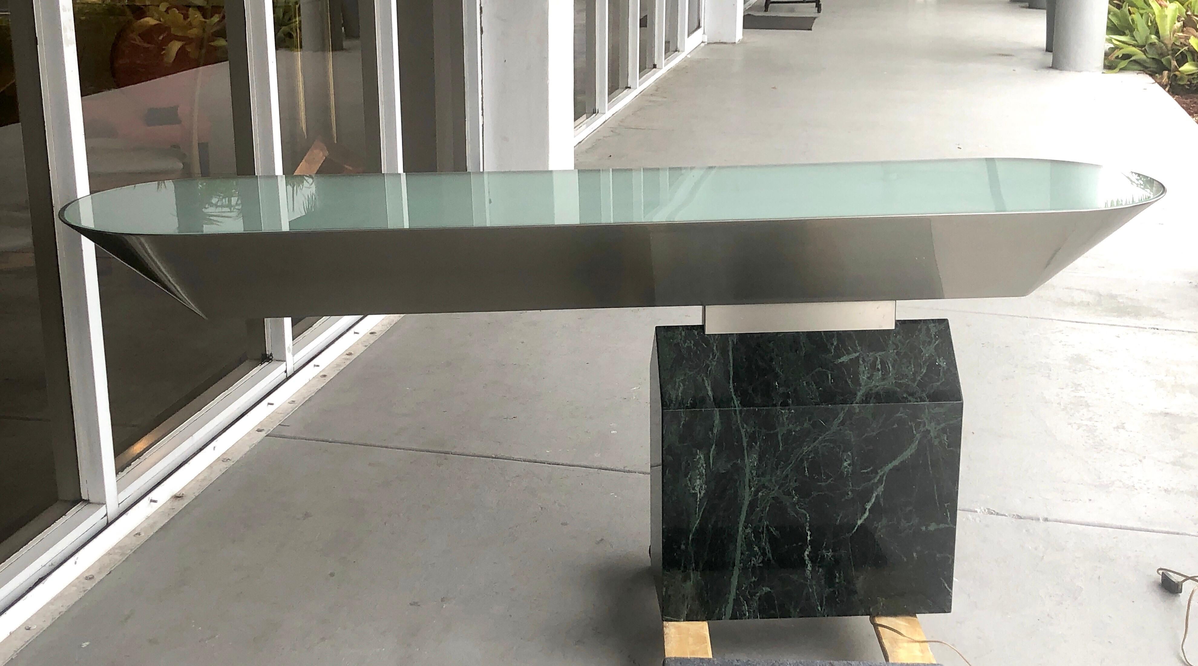A wonderful illuminated console be Brueton. Designed by J. Wade Beam. This console has a green marble base and the stainless top has a custom satin finish, not the very polished mirror finish you usually see. Outstanding design.