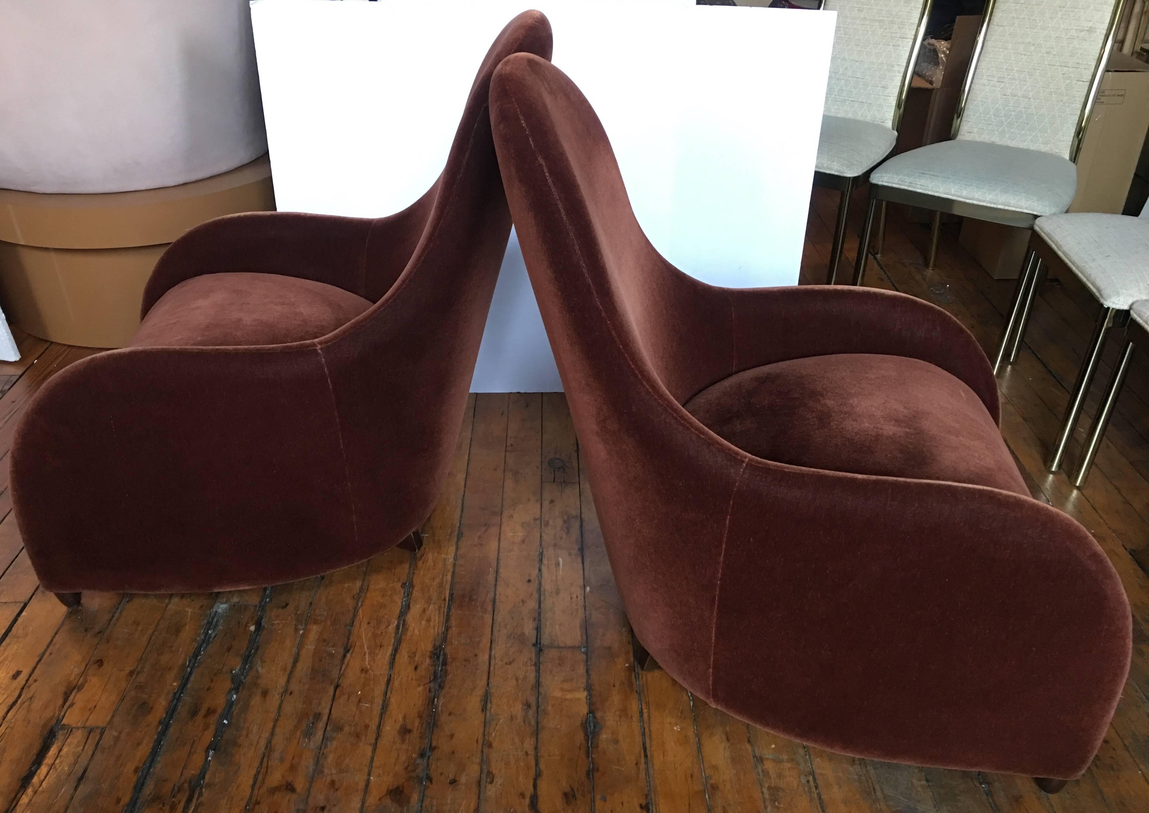 Pair of classical sculptural modern lounge chairs designed by Brueton Industries. Flowing and curved frames feature original chestnut brown tone mohair upholstery. Original upholstery labels dated 2009 on bottom of both chairs.
   