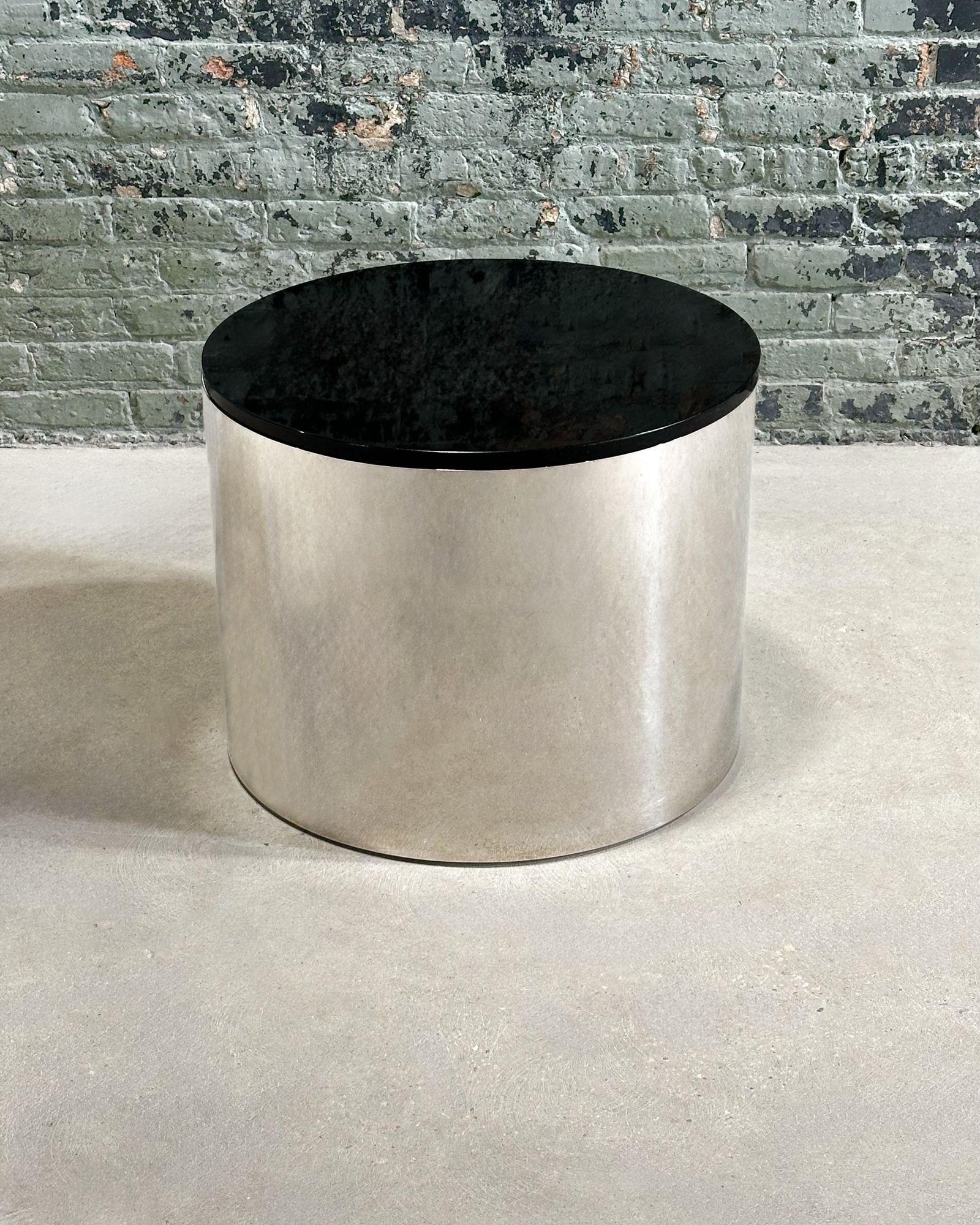 Brueton Polished Stainless Steel/Marble Drum side/end Table, 1970. Original with beautiful black marble.
Measures 18.75