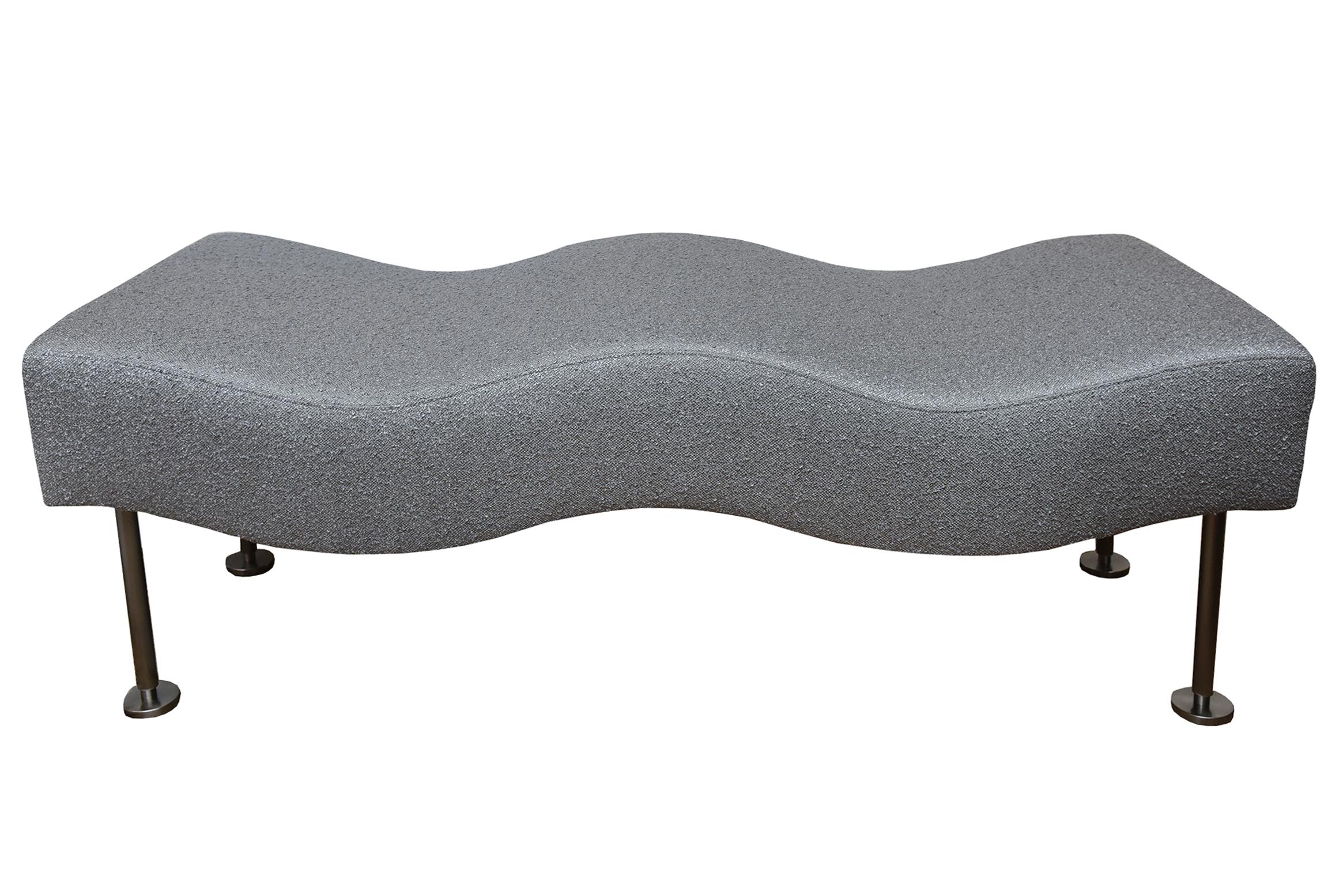 This undulating wave sculptural bench or chaise lounge was designed by Stanley Jay Friedman for Brueton in the 80's. The name of the bench is called the undulatus bench. It is backless and fabulous! The legs are brushed stainless steel. It has been