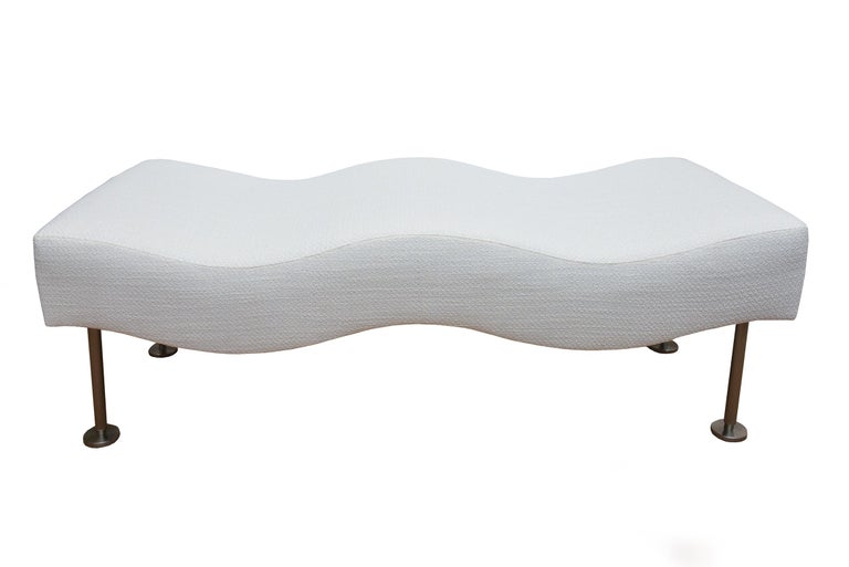 This Brueton vintage backless and undulating wave chaise bench is very sculptural. It was designed by Stanley Jay Friedman for Brueton in the 80's and has been coined and titled the Undulatus chaise. It has been newly upholstered in a white textural