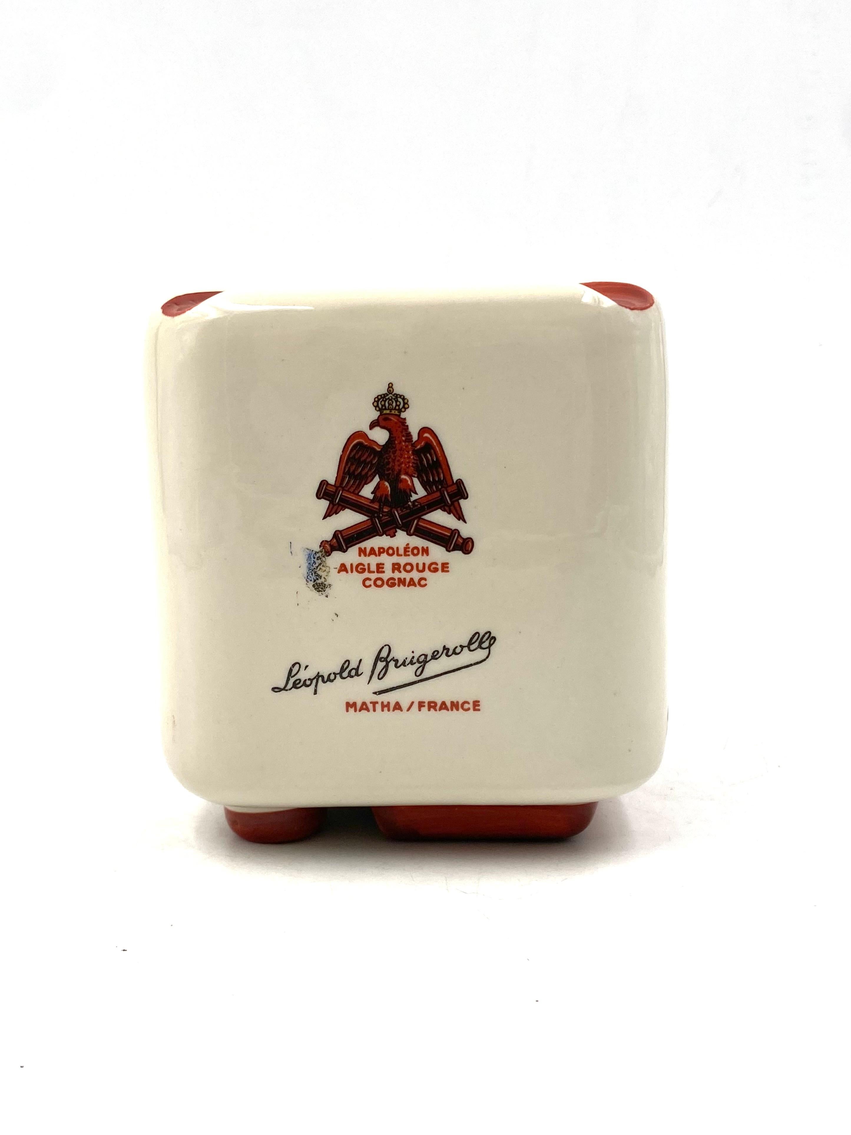 French Brugerolle Aigle Rouge Napoleon Cognac Cubic Ceramic Ashtray, France 1950s For Sale