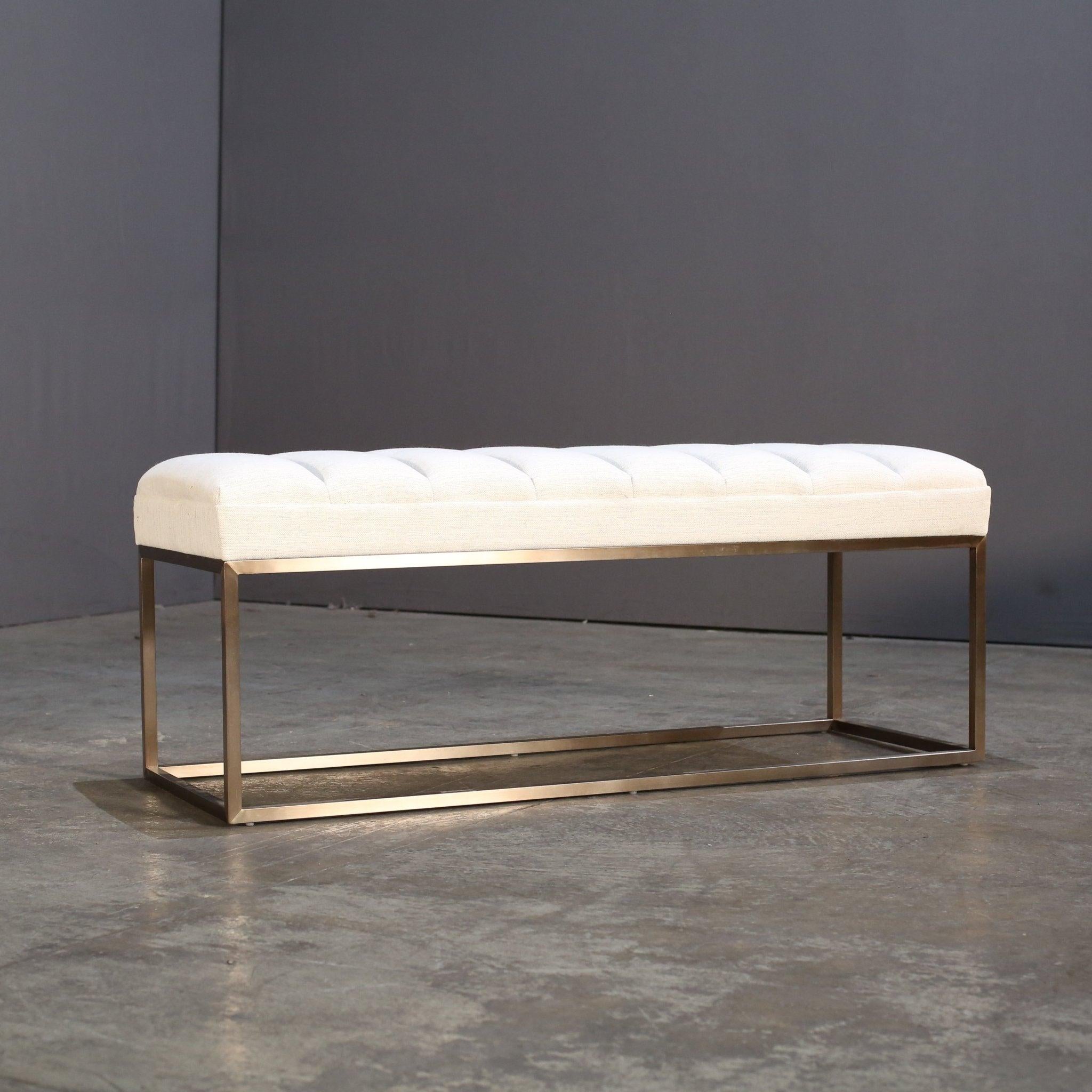 Introducing the Bruges Bench by Robert Langford, a stunning addition to any luxury interior. Crafted with the finest materials and meticulous attention to detail, this bench exudes elegance and sophistication. The sleek, minimalistic design is