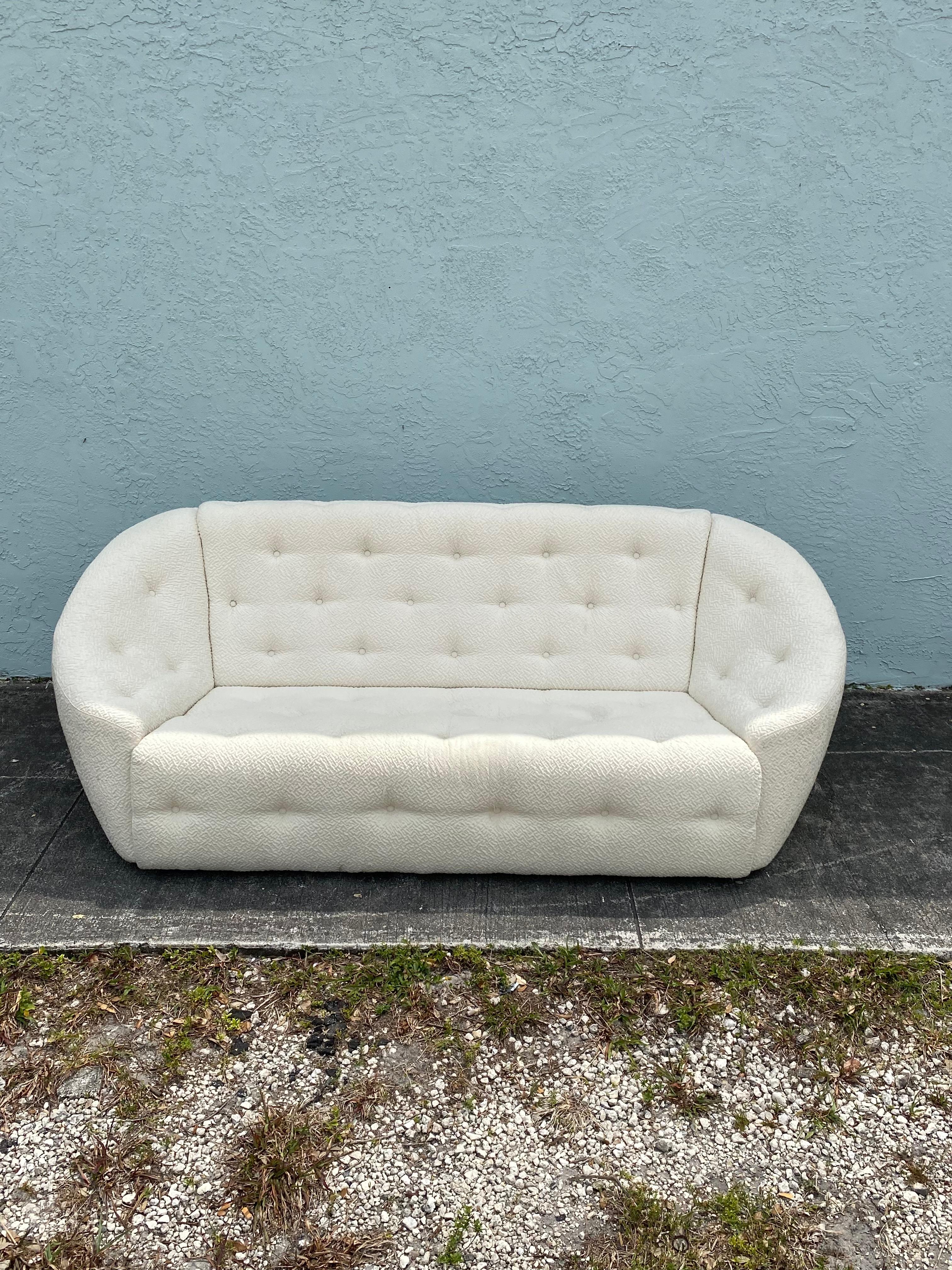 On offer on this occasion is one of the most stunning and rare, sculptural curved sofa you could hope to find. Outstanding design is exhibited throughout. The beautiful sofa is statement piece which is also extremely comfortable and packed with