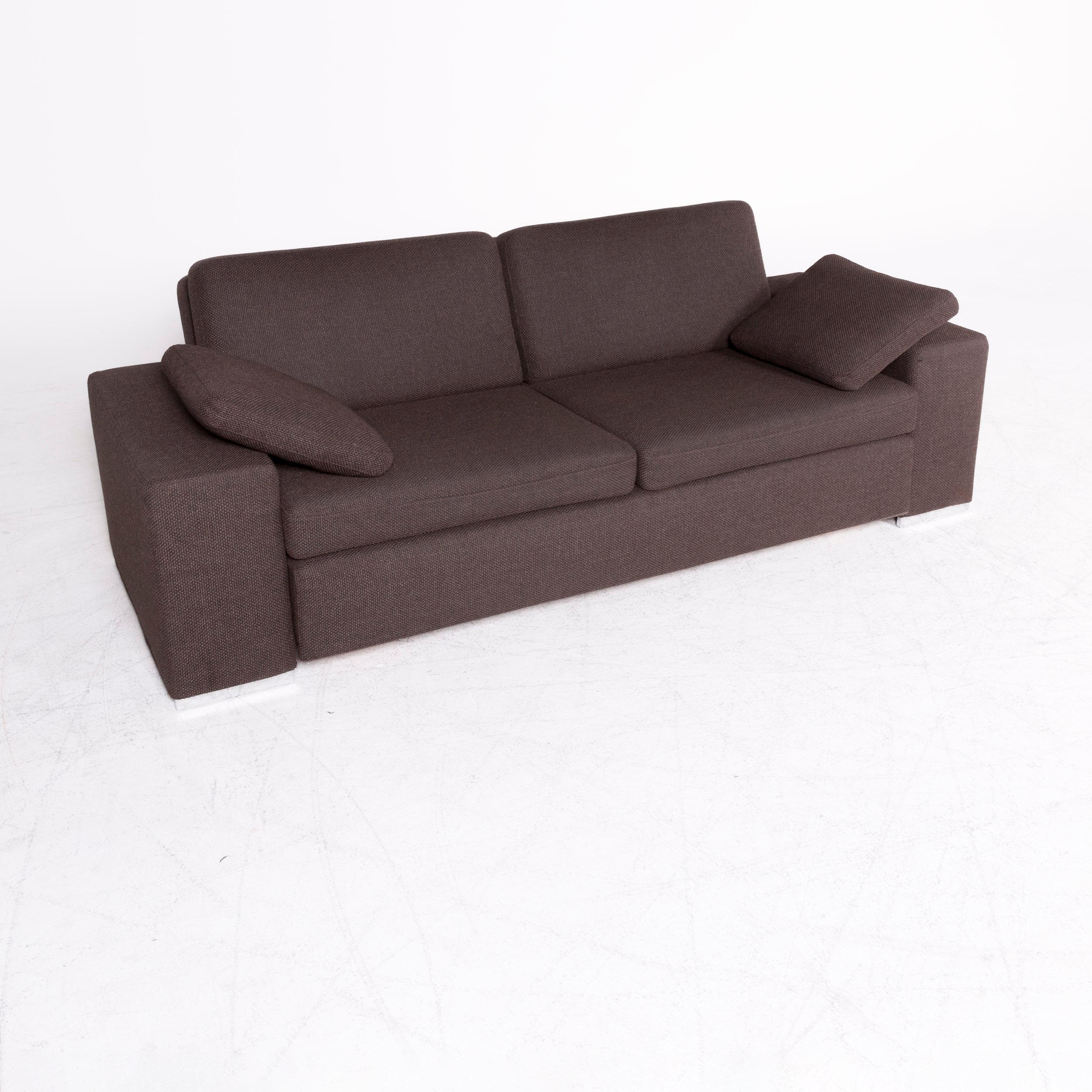 We bring to you a Brühl & Sippold designer fabric sofa brown two-seat sofa function sofa bed.

Product measurements in centimeters:

Depth 103
Width 215
Height 77
Seat-height 41
Rest-height 50
Seat-depth 58
Seat-width 118
Back-height