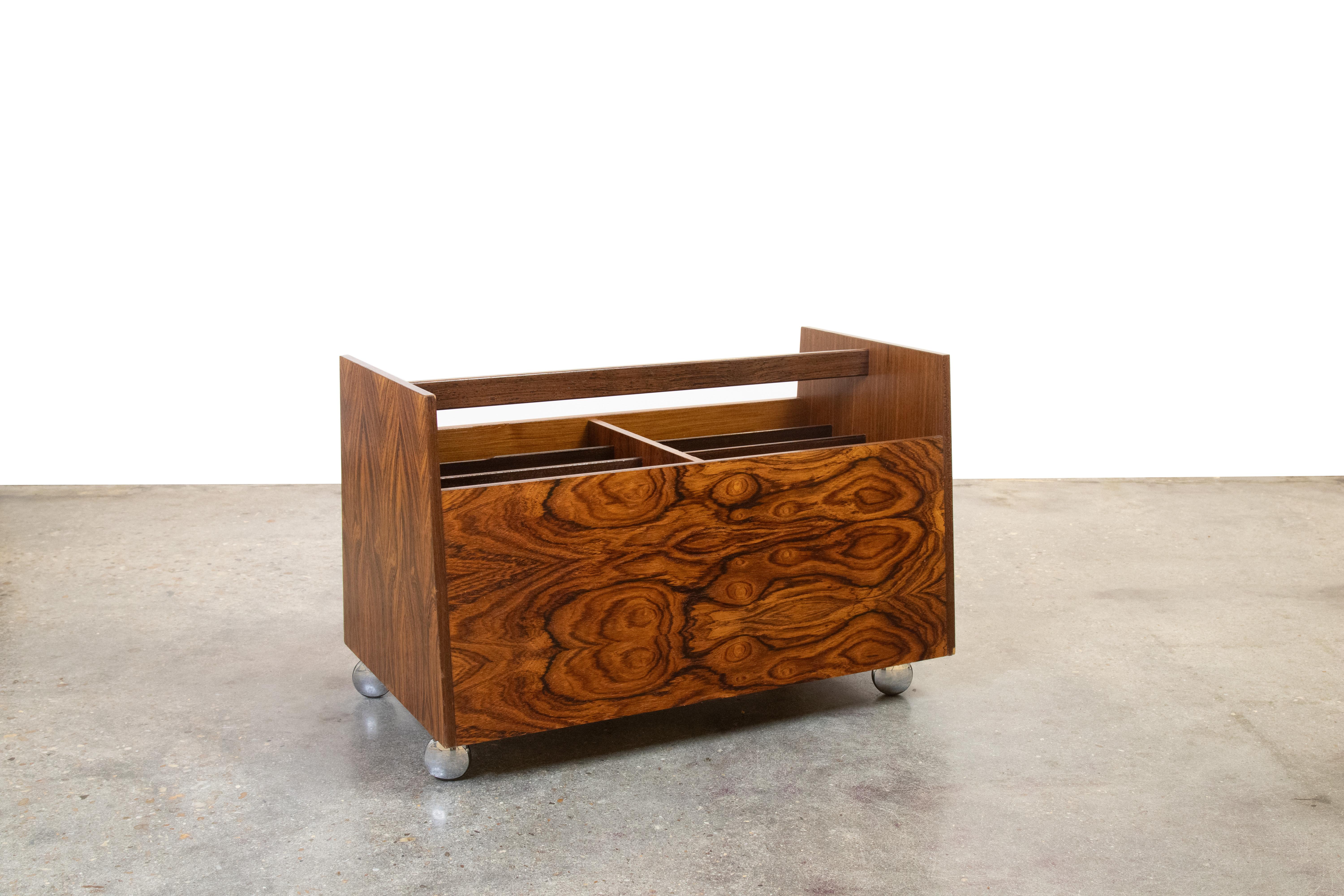 A versatile cart designed by Rolf Hesland for Bruksbo in the 1960’s. Originally designed for storing magazines and books, the now common usage is for storing your vintage record Vinyl LP collection. This example with the most expressive rosewood