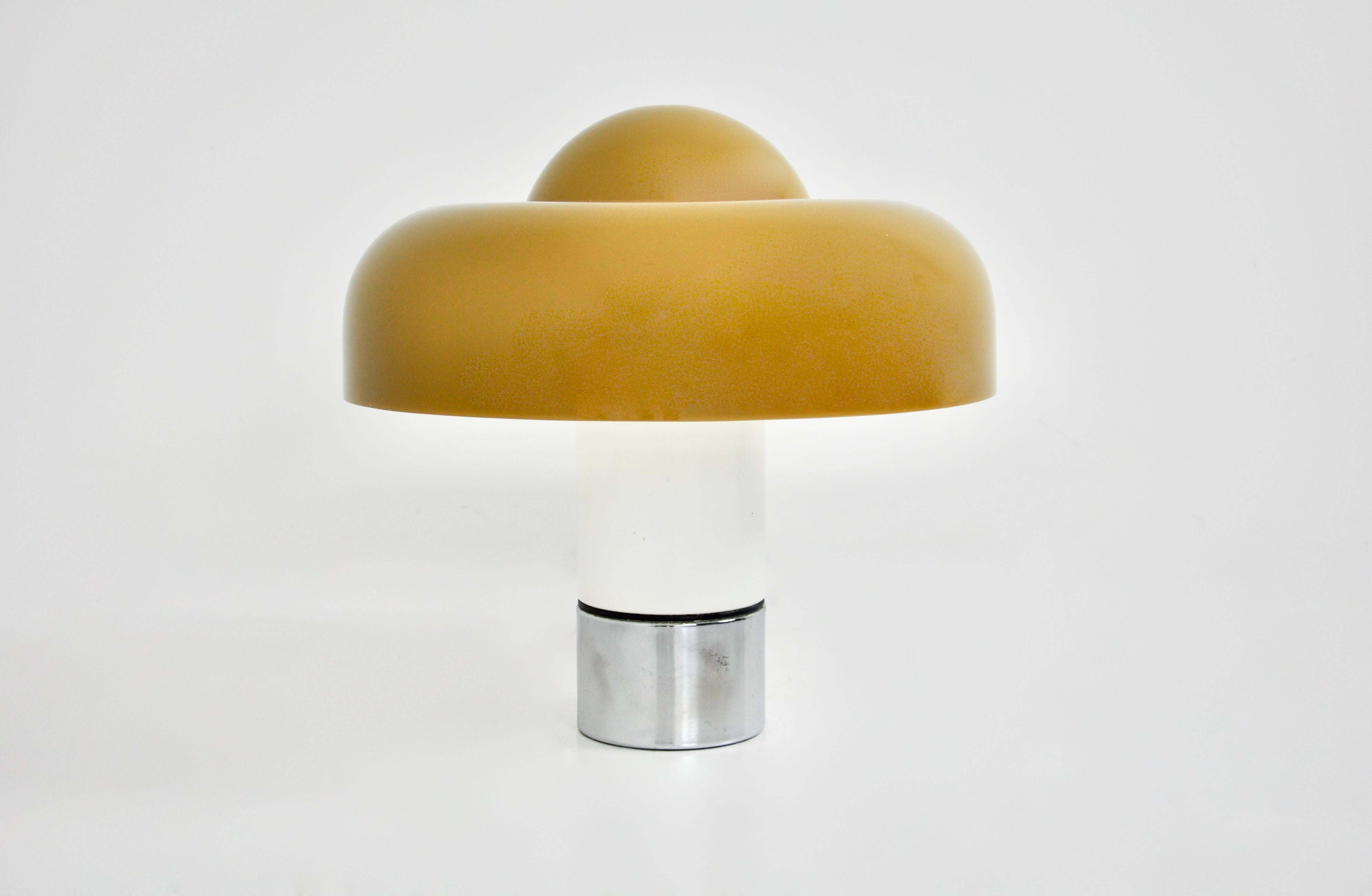 Orange plastic and metal lamp by Luigi Massoni, model Brumbury. Double switch to choose to light a part or the wholeWear due to time and age of the lamp.
