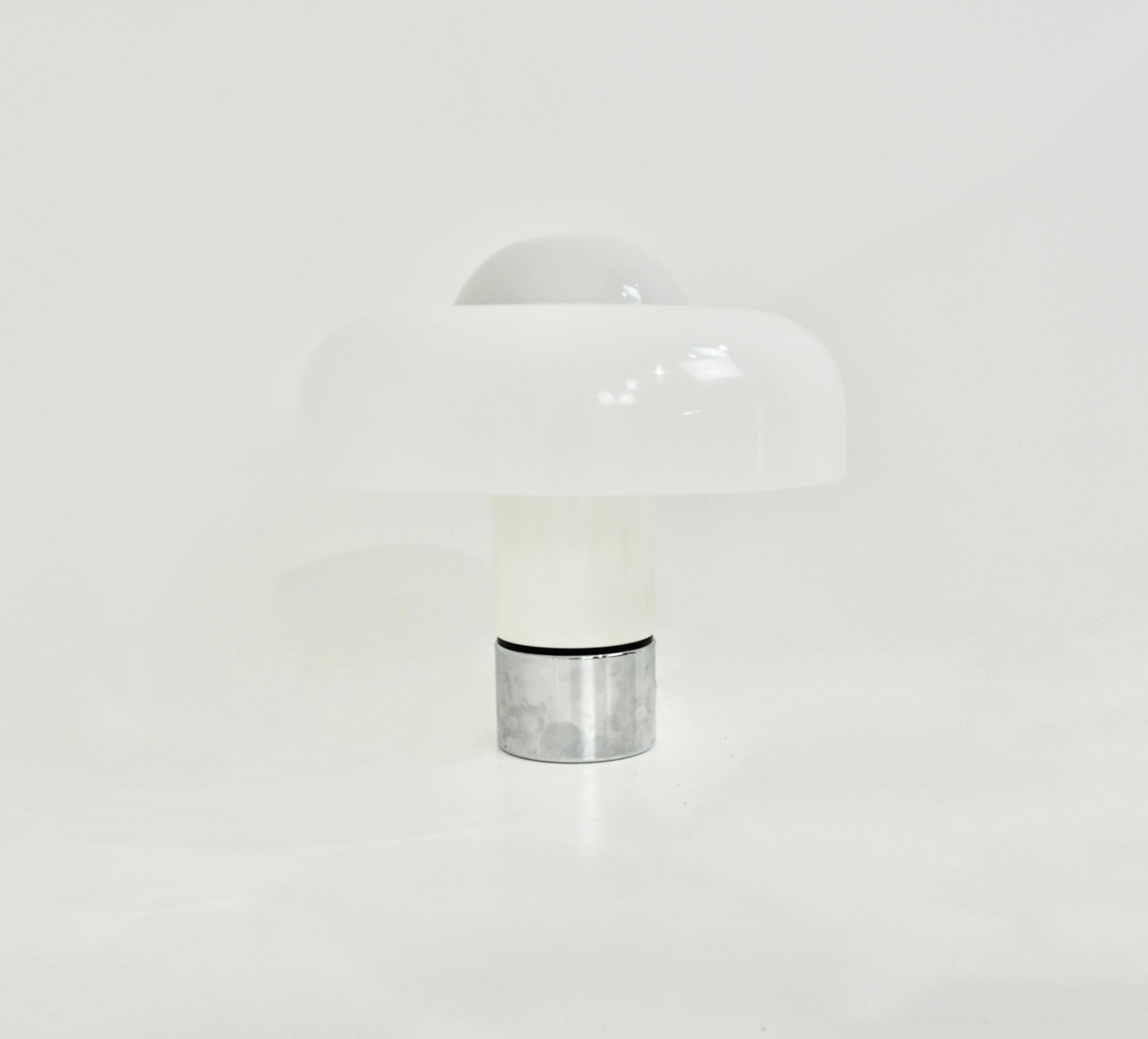 White plastic and metal lamp by Luigi Massoni, model Brumbury.  Double switch for choosing to light part or all of the lamp. Stamped Harvey Guzzini Wear due to time and age of the lamp.