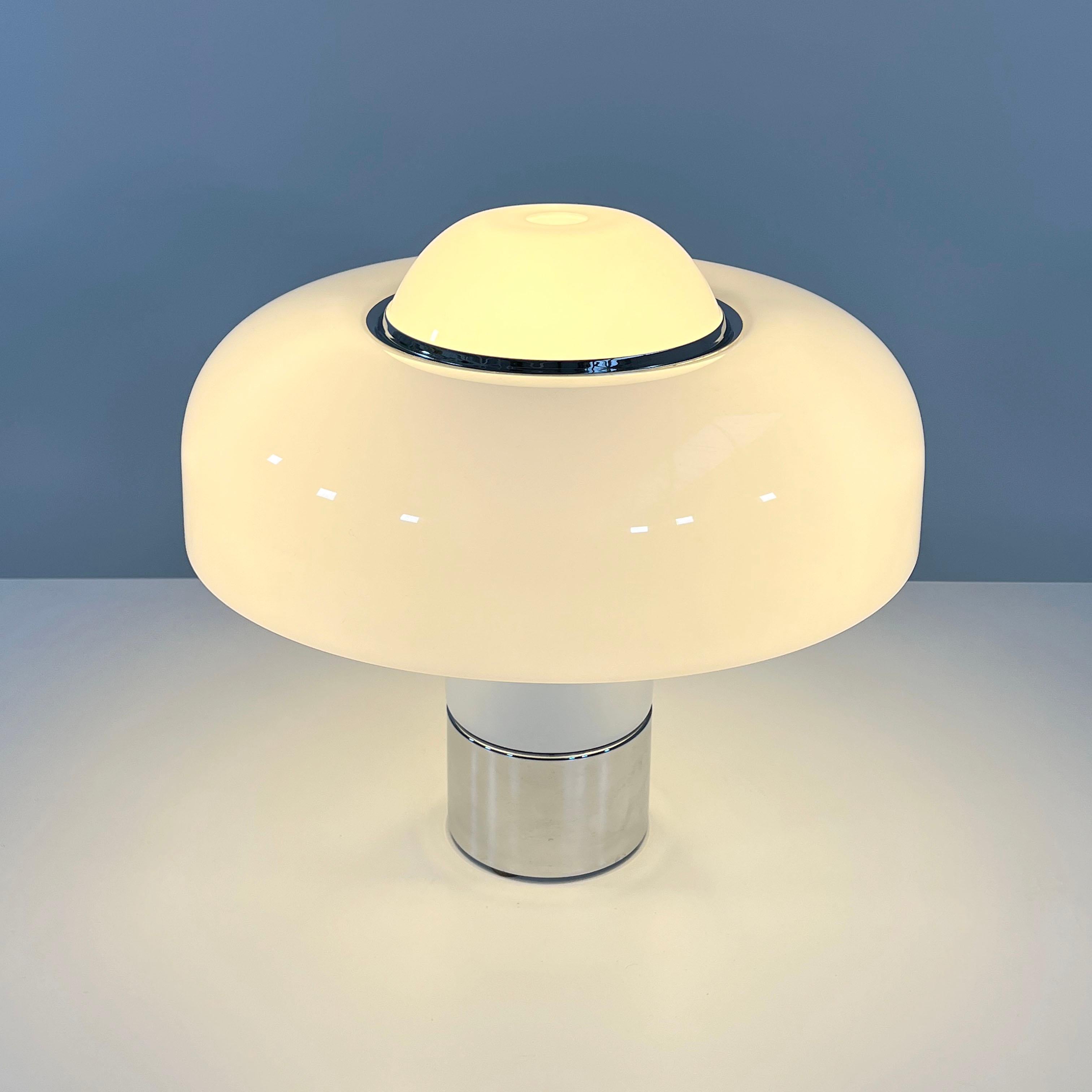Designer - Luigi Massoni
Producer - Guzzini
Model - Brumbury Table Lamp
Design Period - Seventies
Measurements - Width 50 cm x Depth 50 cm x Height 50 cm 
Materials - Perspex plastic, chrome plating, metal 
Color - White, Silver
Light wear