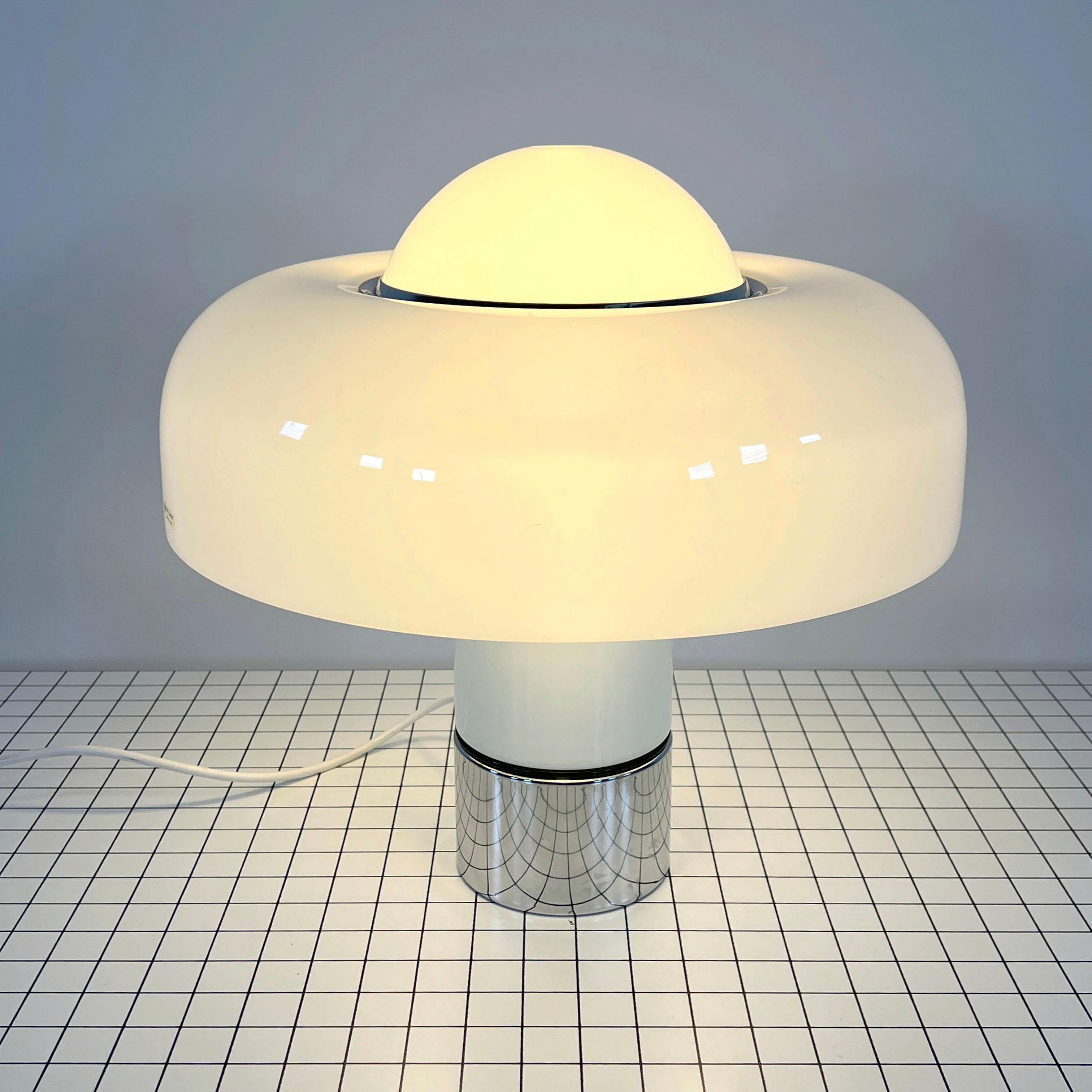 Designer - Luigi Massoni
Producer - Guzzini
Model - Brumbury Table Lamp
Design Period - Seventies
Measurements - Width 50 cm x Depth 50 cm x Height 50 cm 
Materials - Perspex plastic, chrome plating, metal 
Color - White, Silver
Electrical