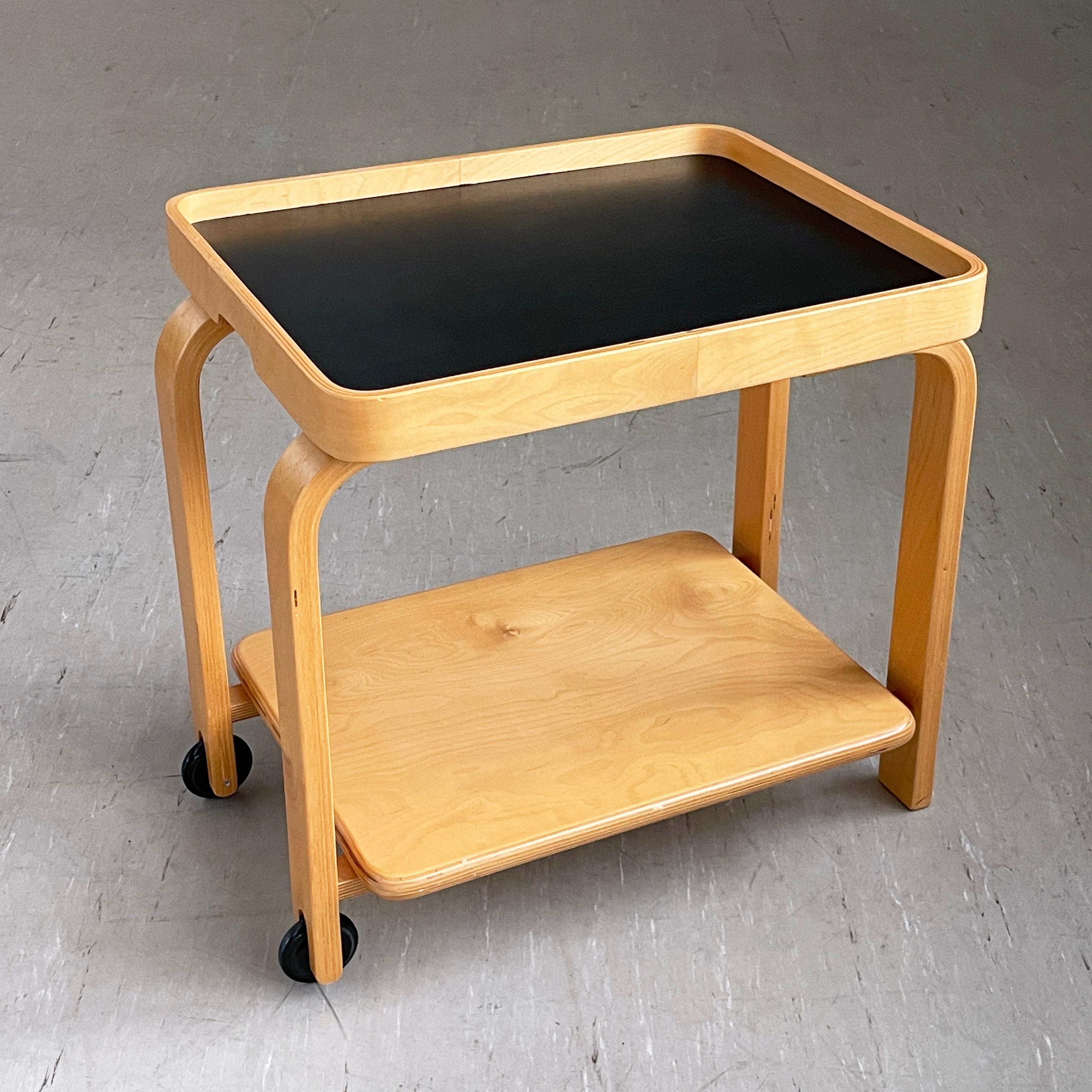 'Brunabo' serving trolley / drinks cart. Designed by Carina Bangs, for IKEA, 2004. 
Bentwood construction with separate removable tray tabletop. Coasters at one end for maneuverability. A great design with multiple uses. Also makes a stylish side
