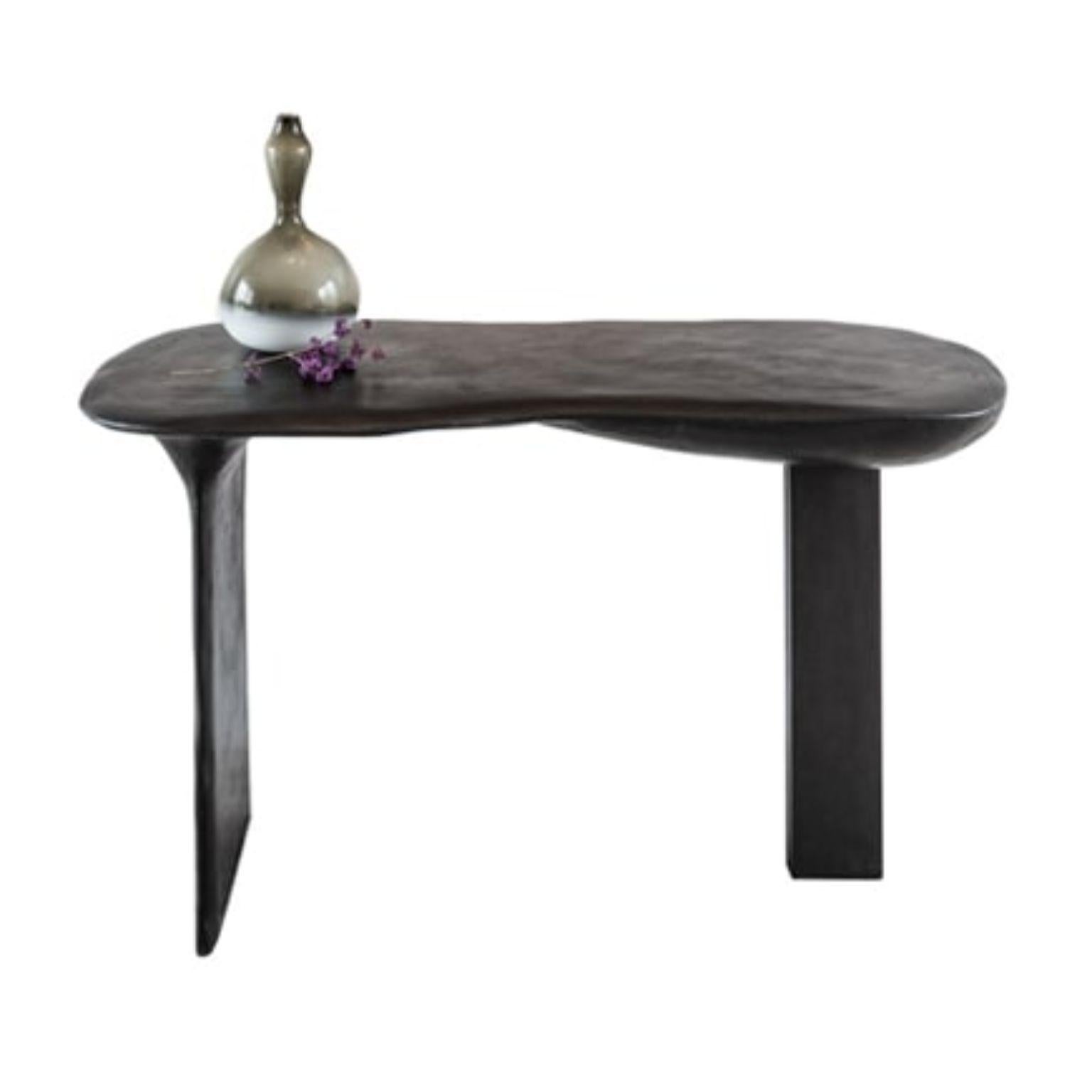 Brunate console table by Studio Emblématique
Dimensions: W 143 x D 60 x H 85 cm 
Materials: Stone grain

  

Pushing the boundaries, going the extra mile to find the extraordinary piece that defines the space. Embracing craftsmanship and