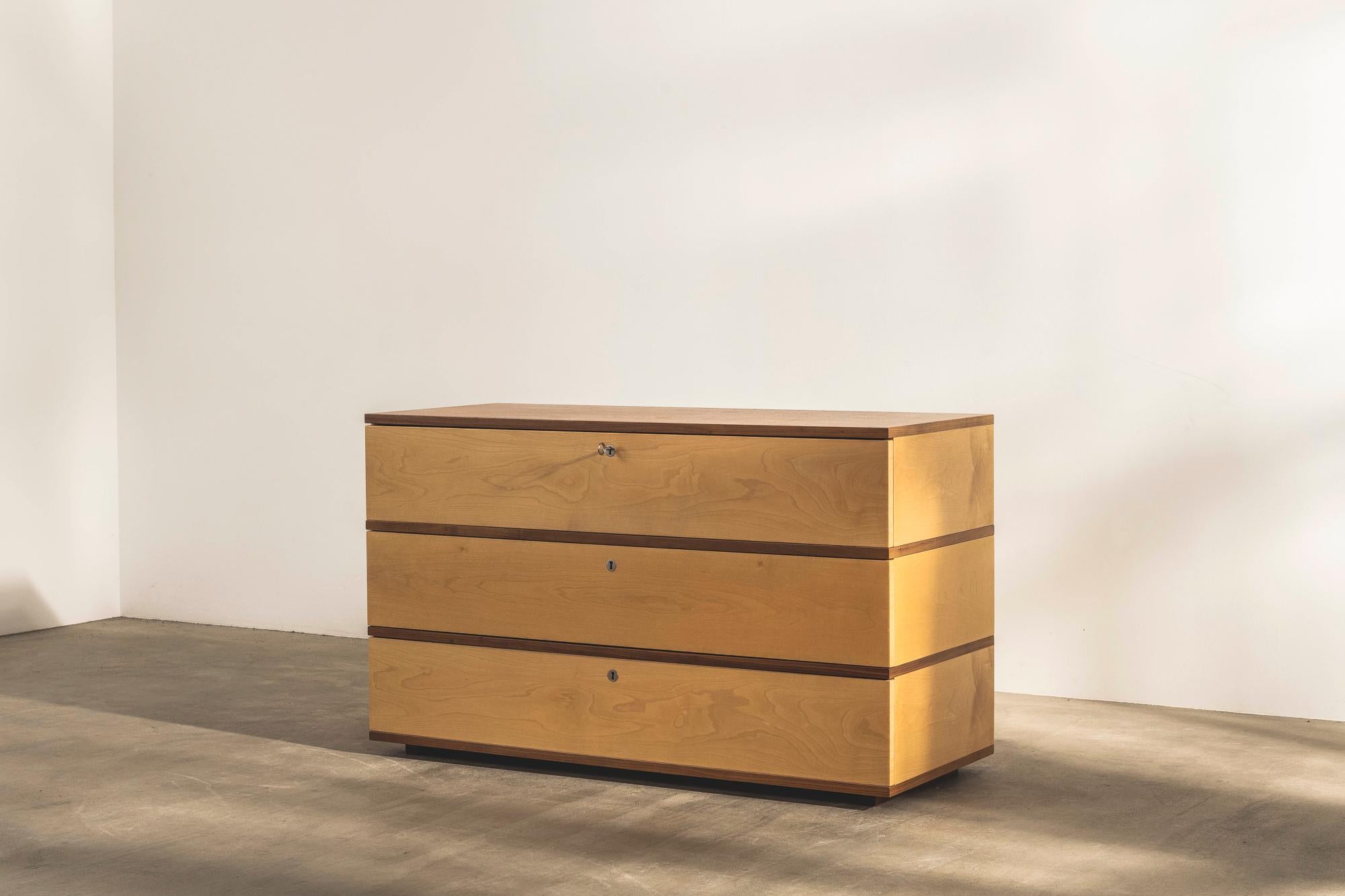 A fine chest of drawers in sycamore with the key doubling as the handle. Available with three drawers.