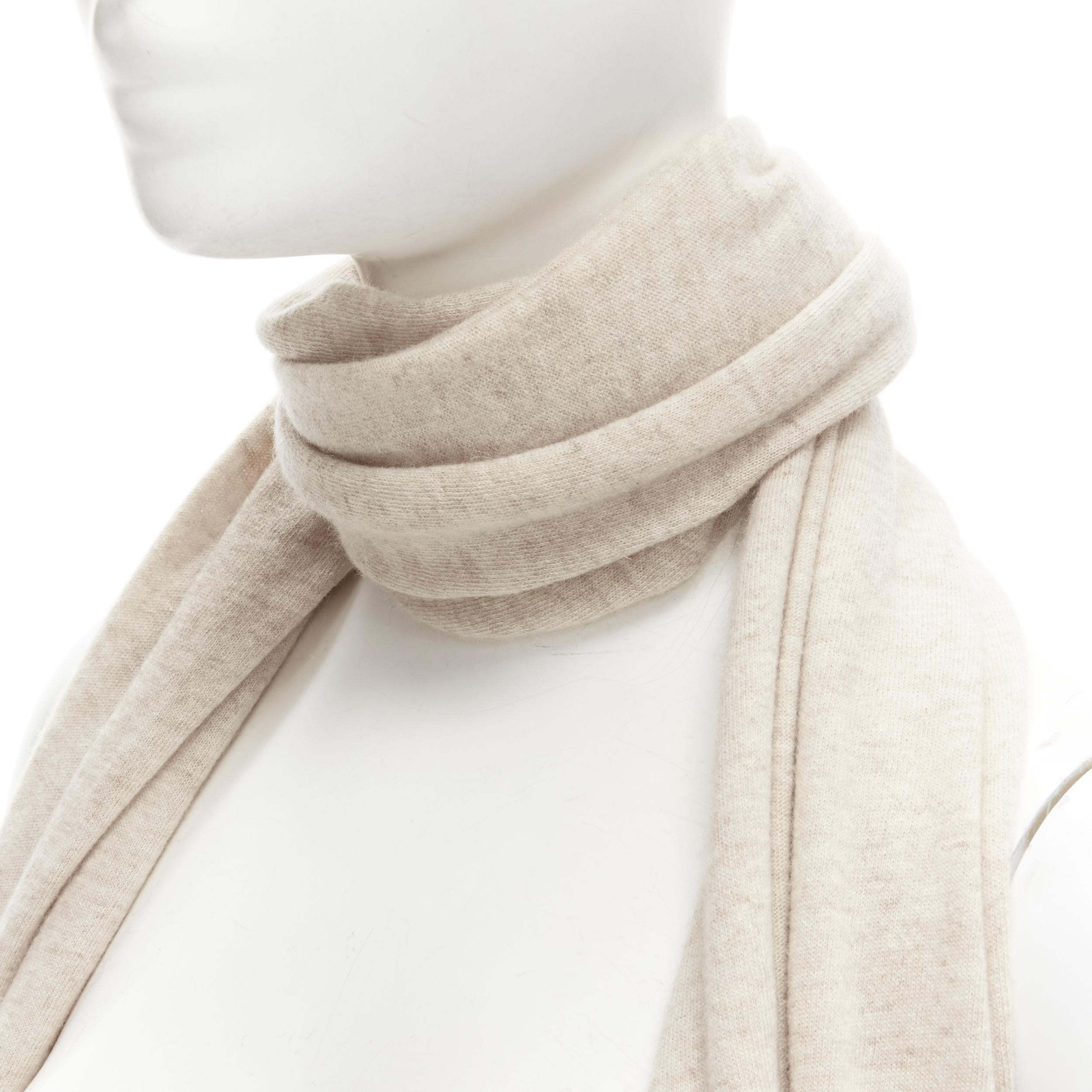 BRUNELLO CUCINELLI 100% cashmere beige rolled edges scarf
Brand: Brunello Cucinelli
Material: Cashmere
Color: Beige
Pattern: Solid
Extra Detail: Rolled edges.
Made in: Italy

CONDITION:
Condition: Good, this item was pre-owned and is in good