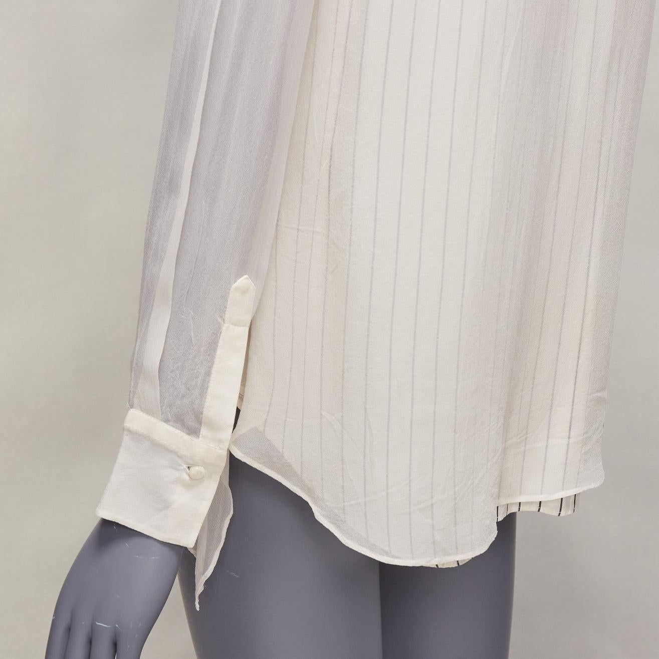 BRUNELLO CUCINELLI 100% silk cream grey layered panels sheer shirt XS
Reference: EALU/A00005
Brand: Brunello Cucinelli
Material: Silk
Color: Cream
Pattern: Pinstriped
Closure: Button
Lining: Cream Silk
Extra Details: Layered shirt effect and sheer