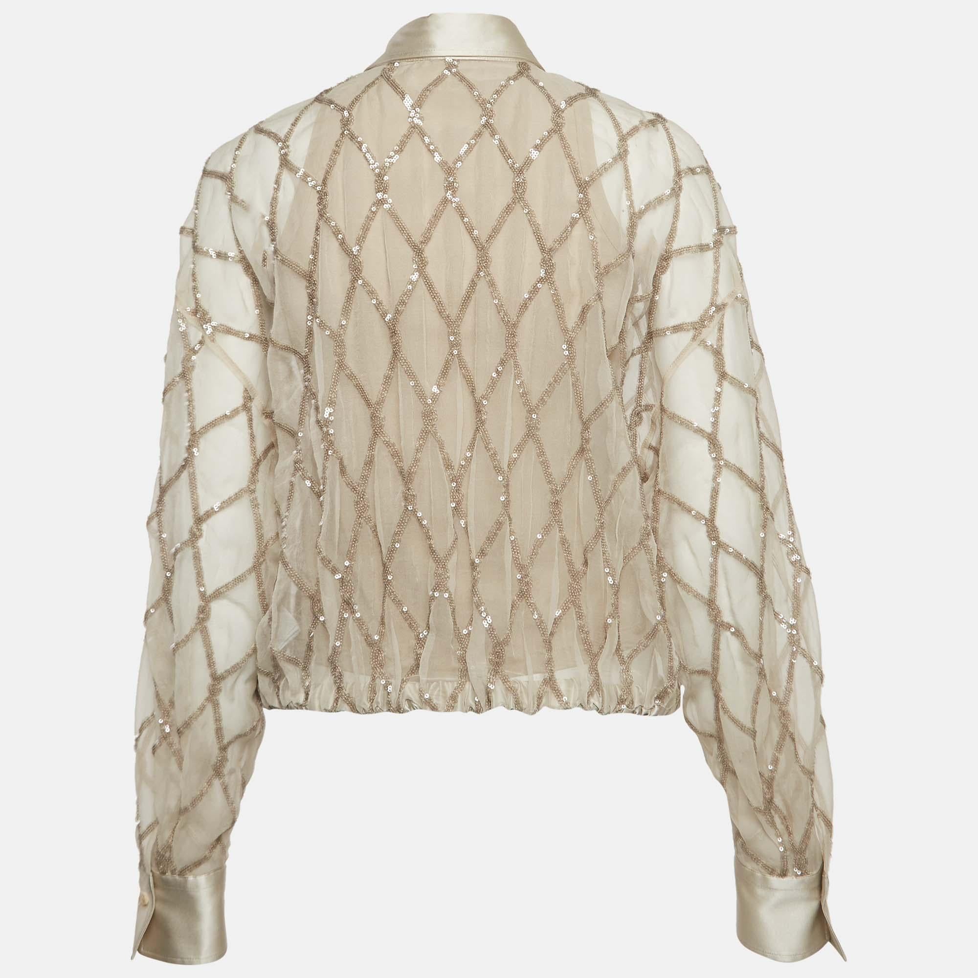 Whether you want to go out on casual outings with friends or just want to lounge around, this Brunello Cucinelli shirt is a versatile piece and can be styled in many ways. It has been made using silk and elevated with eye-catching sequins.


