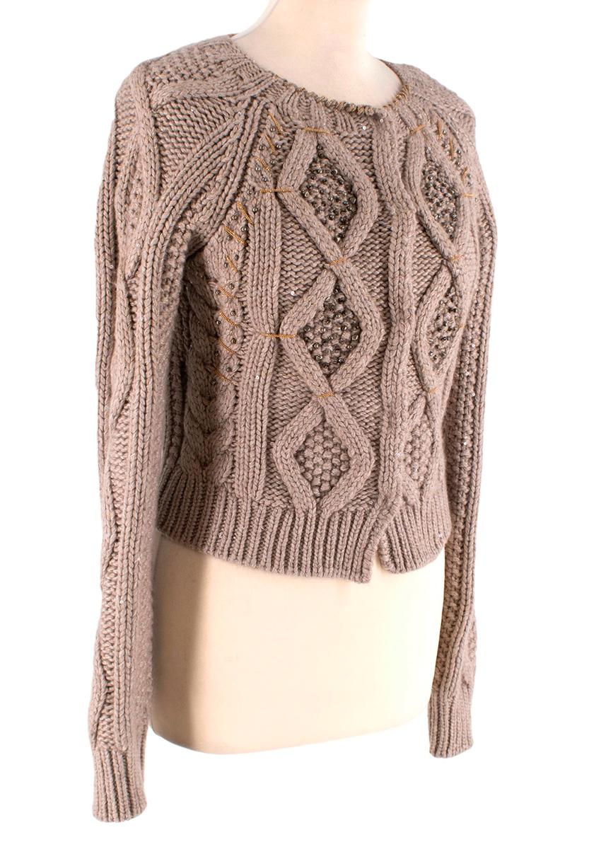  Brunello Cucinelli Beige Cashmere Embellished Cardigan
 

 - Cashmere cable knit in warm beige marl, sprinkled with small tonal sequins, and decorative bead and chain work
 - Round neck, long sleeve
 - Concealed popper fastening
 

 

 Materials 
