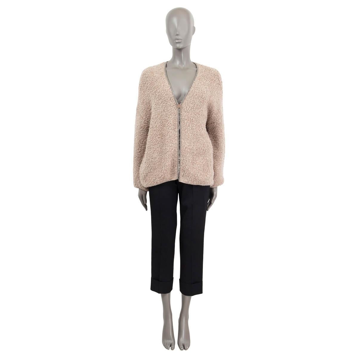 100% authentic Brunello Cucinelli teddy single button cardigan in beige cashmere (90%) and polyamide (10%). Features molini-chain trim in silver, and a v-neck. Unlined Has been worn and is in excellent condition. 

Measurements
Tag