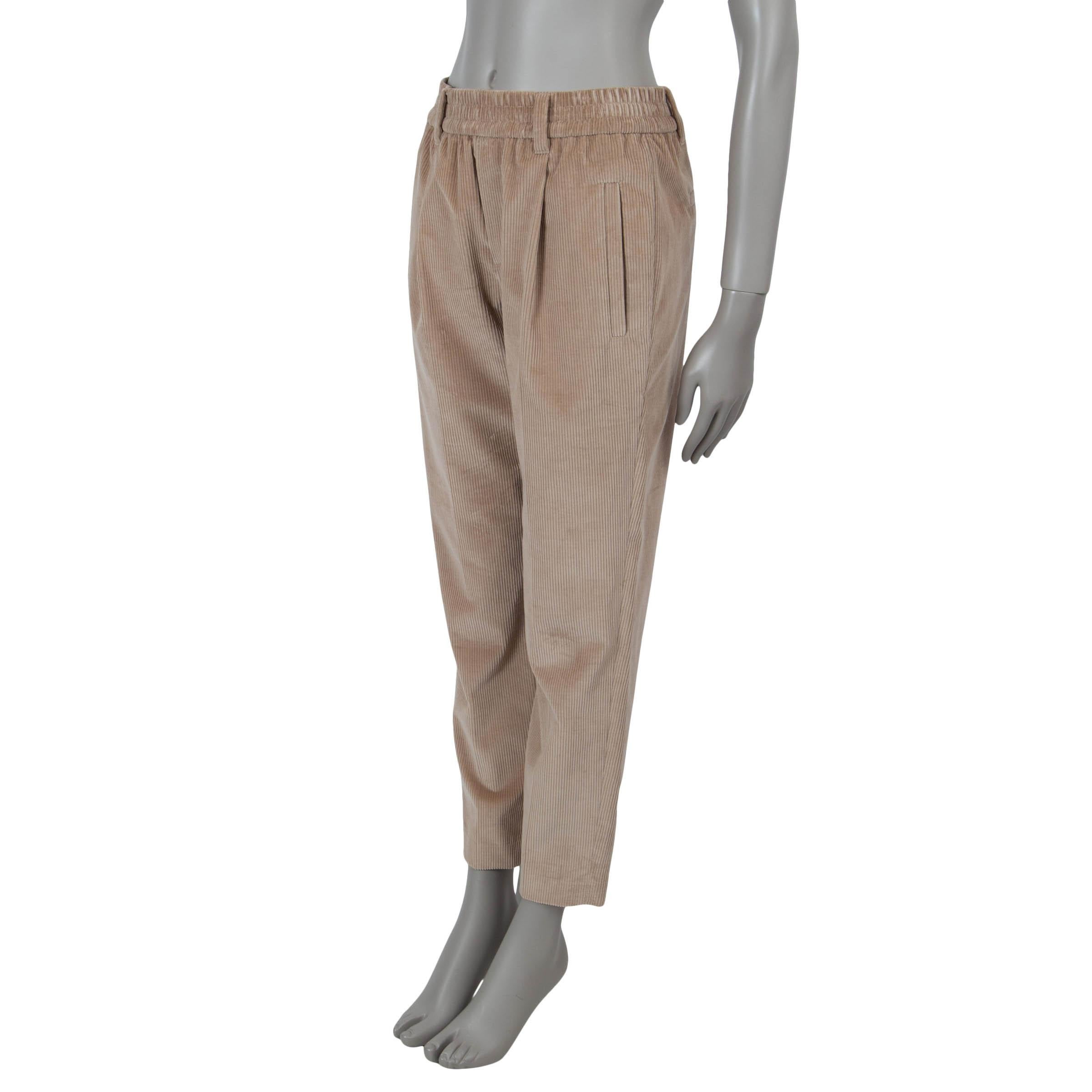 This 100% authentic Brunello Cucinelli pants in brown corduroy cotton (100%) exude understated sophistication. Featuring a mid-rise and straight legs, they are designed with an elastic waistband for effortless wear, adorned with Monili beading