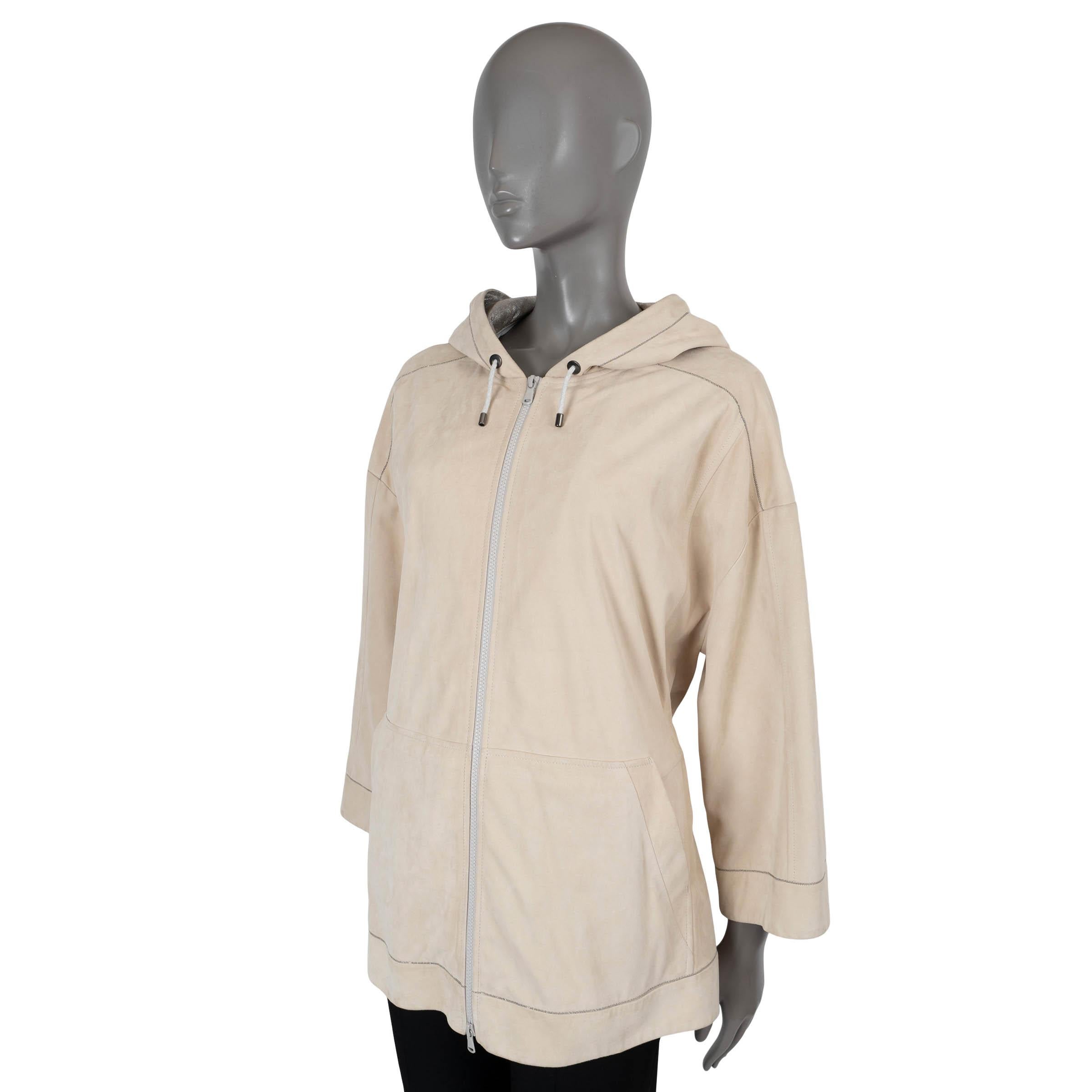 100% authentic Brunello Cucinelli hooded jacket in pale beige leather. Features Monili trim on the cuffs and bottom hem, a drawstring hood line din wrinkled metallic silver lambskin, a drawstring waist, two slits on the side and kangaroo pockets on
