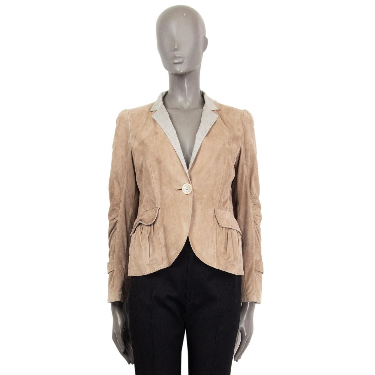 authentic Brunello Cucinelli single breasted one button jacket in beige suede leather (100%) and in gray cotton (100%) neck with flap pleated pockets and embellished cuffs. Closes with one button on the front and has a belt detail on the back. Is