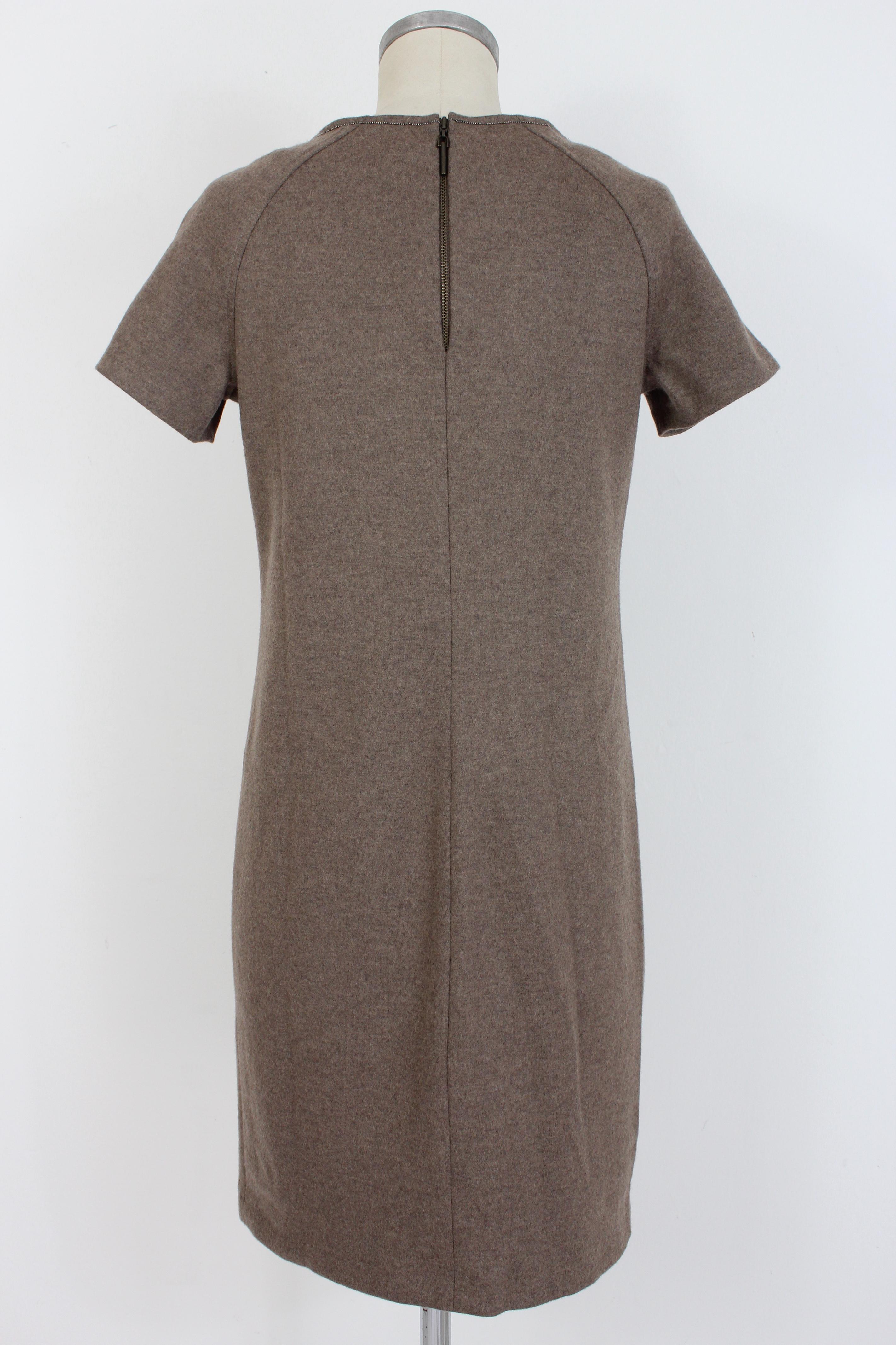 Sweater dress in 100% fine virgin wool by the designer Brunello Cucinelli. Made with the best Italian tailoring techniques in 100% fine virgin wool. Soft touch fabric, linear fit. Short sleeves and boat neckline, the dress is embellished with a line