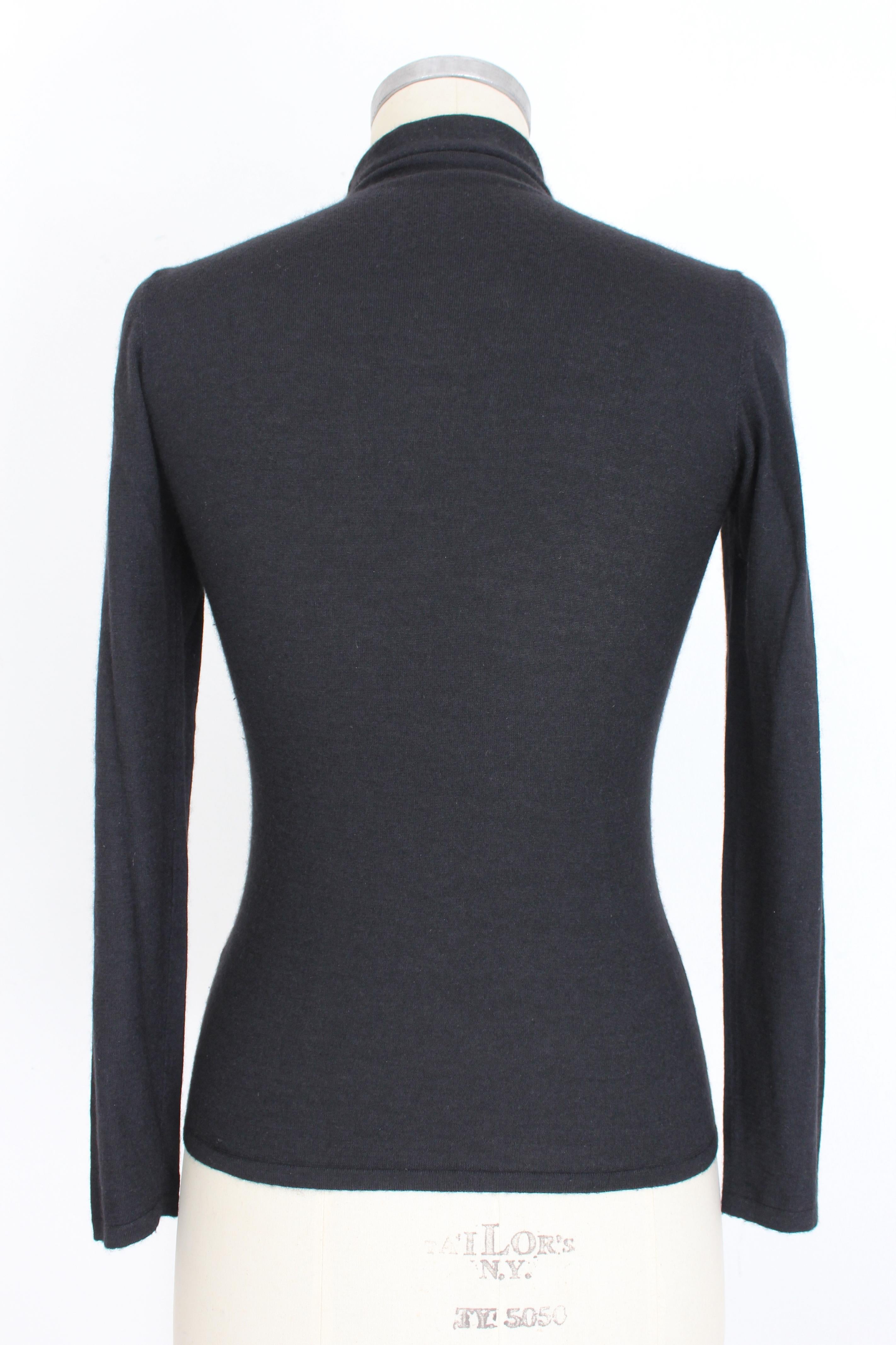 Sweater in silk and cashmere by the designer Brunello Cucinelli, color black. Made with the best Italian manufacture in soft cashmere and silk. Comfortable turtle neck. The very soft fabric is 70% cashmere and 30% silk. Made in Italy, size small.