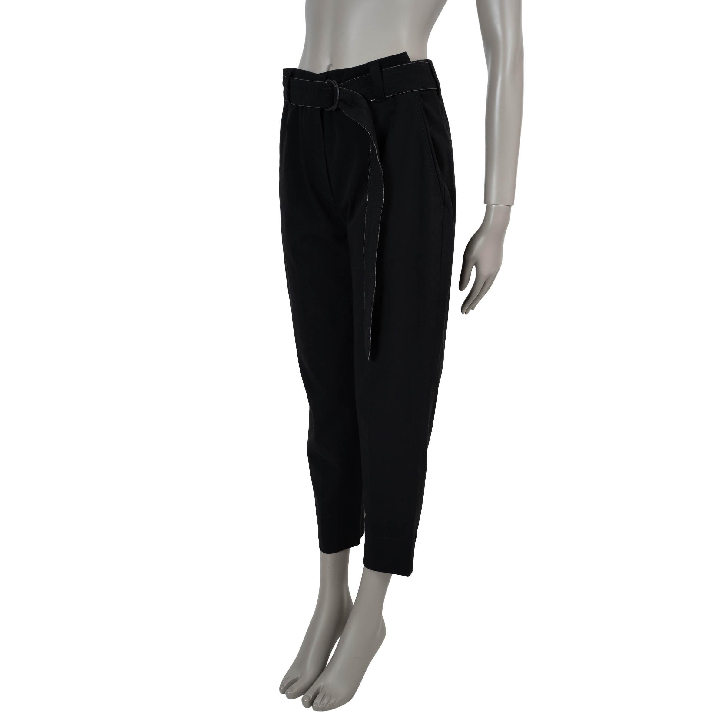 This 100% authentic Brunello Cucinelli pants in black cotton embody refined simplicity with a signature touch. Designed with tapered legs, they feature a Monili-trimmed belt for a subtle hint of elegance. Two slant pockets at the hips and two welt