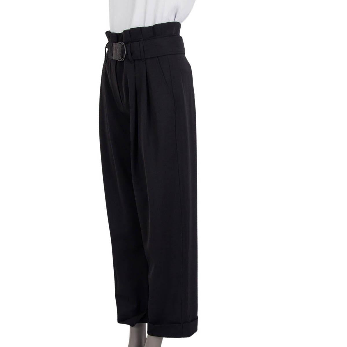 100% authentic Brunello Cucinelli pleated wide leg pants in black wool (76%), polyamide (22%) and elastane (2%). Feature a detachable belt which is embellished with small studs, two slit pockets at the sides and one sewn shut slit pockets at the