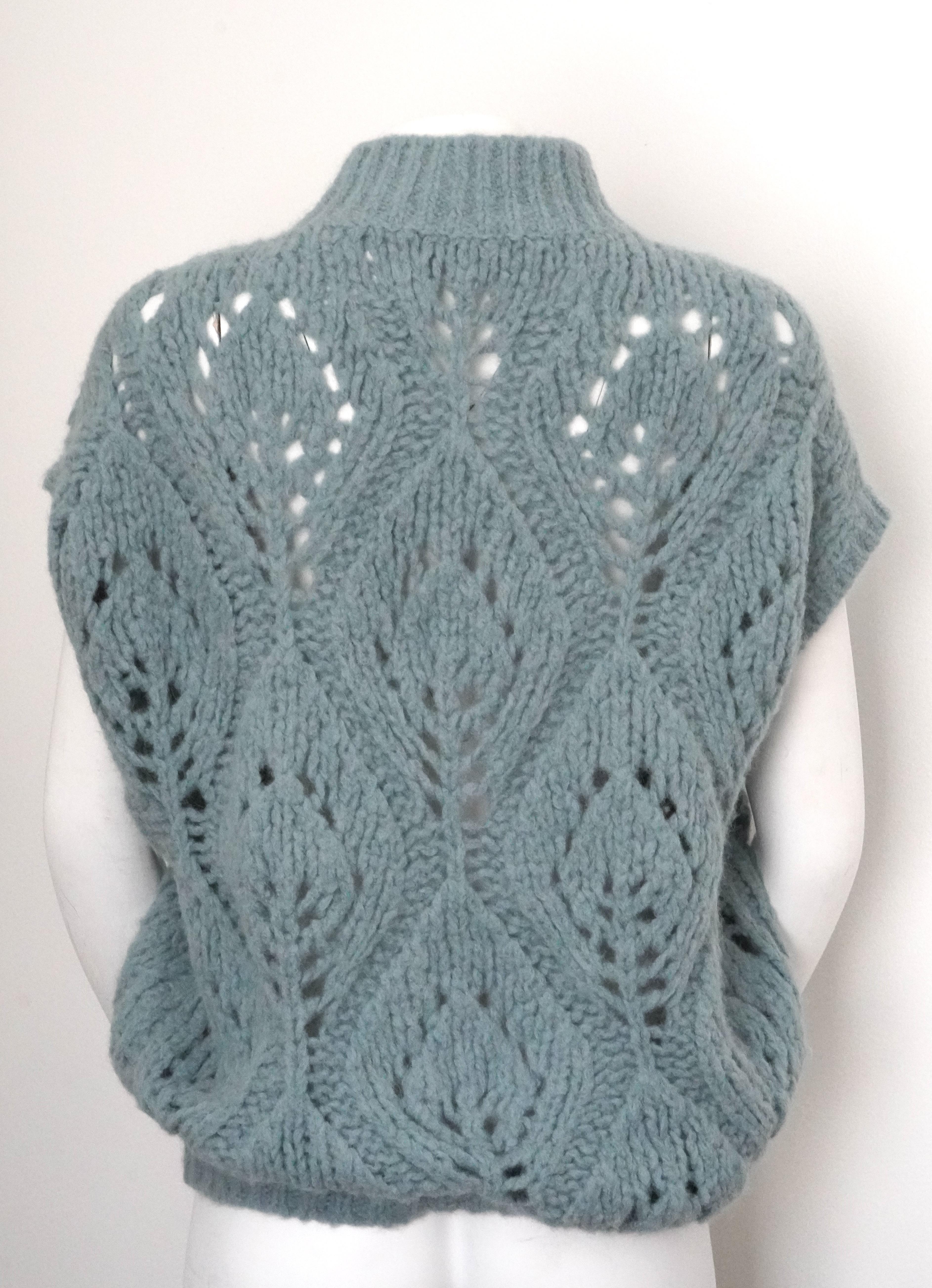 Pastel blue alpaca wool-blend short-sleeved jumper from BRUNELLO CUCINELLI featuring knitted openwork construction, ribbed detailing, high neck and short sleeves.
Length: 27 inches
Bust: 52 inches
Missing the size tag 