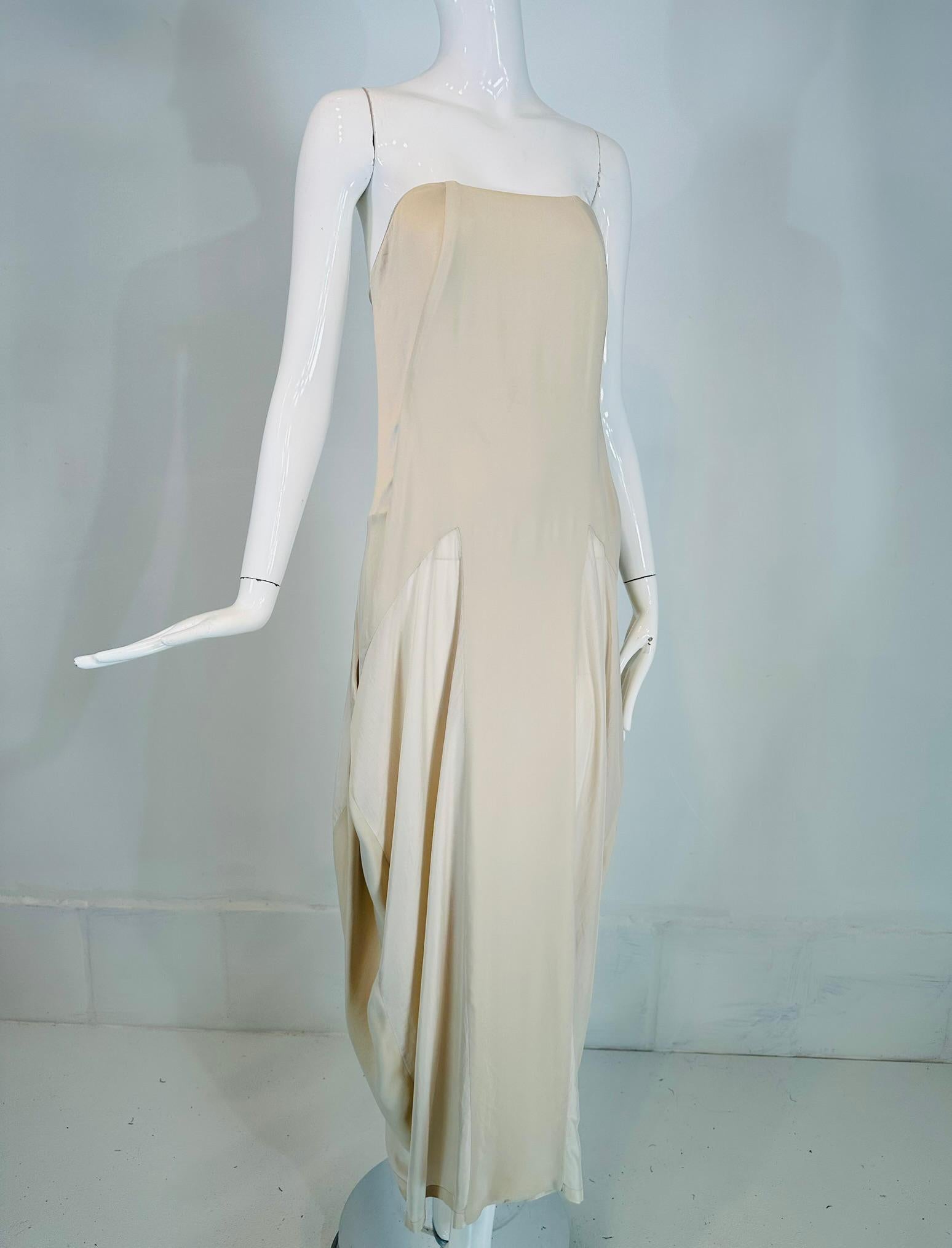 Burnello Cucinelli bone on bone silk chiffon strapless bias cut pieced lightweight silk. Boned bodice, the dress is fitted through the bodice. Bias pieced waist, forms, pockets, not real pockets but open draped sides that could be pockets. The