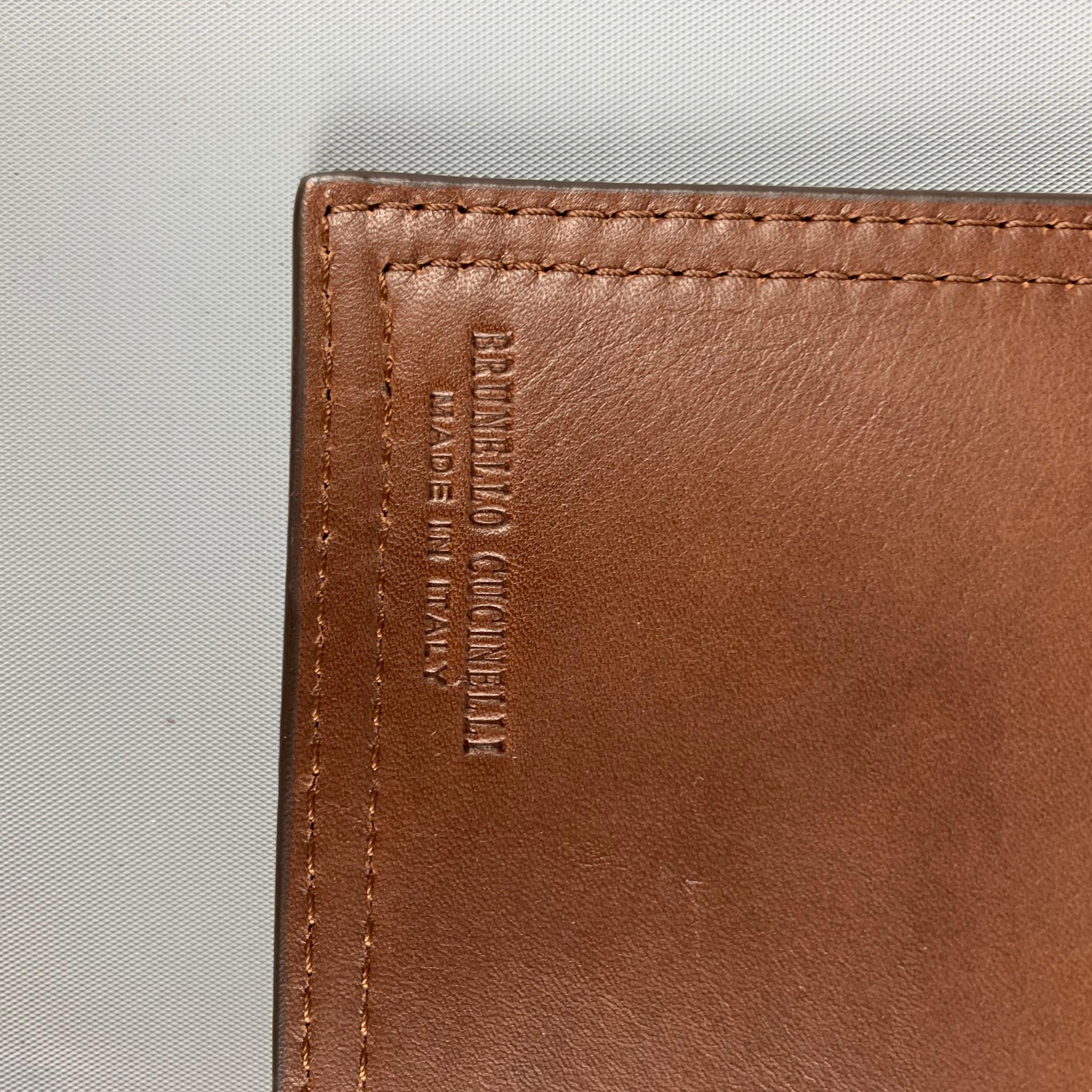 BRUNELLO iPad case comes in a brown leather featuring inner slots and a toggle turn lock closure. Made in Italy. 

Very Good Pre-Owned Condition.
Original Retail Price: $780.00

Measurements:

Length: 10 in.   
Height: 8.5 in.