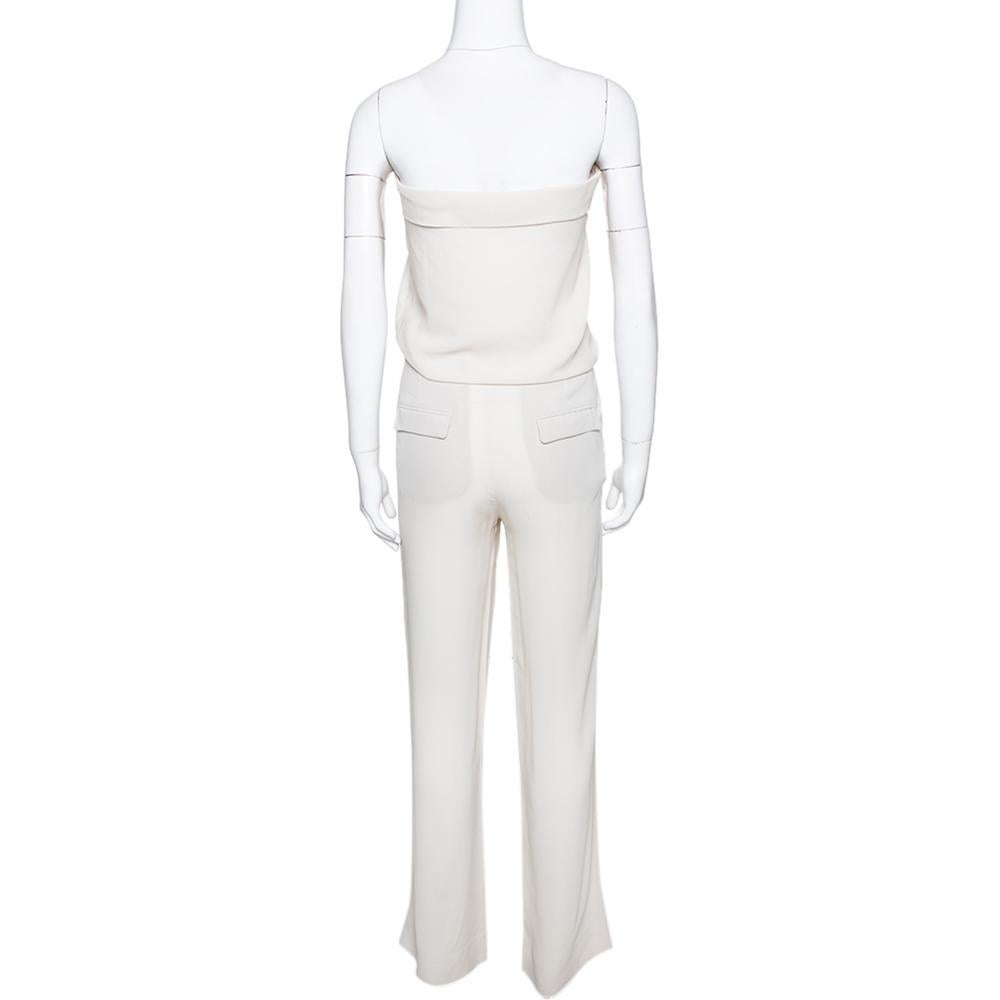 Get summer brunch ready with this Brunello Cucinelli jumpsuit. Crafted from pure silk, this luxurious creation comes in a versatile shade of cream. It has a strapless style, a flattering silhouette, four pockets, tailored trousers and a zip closure.