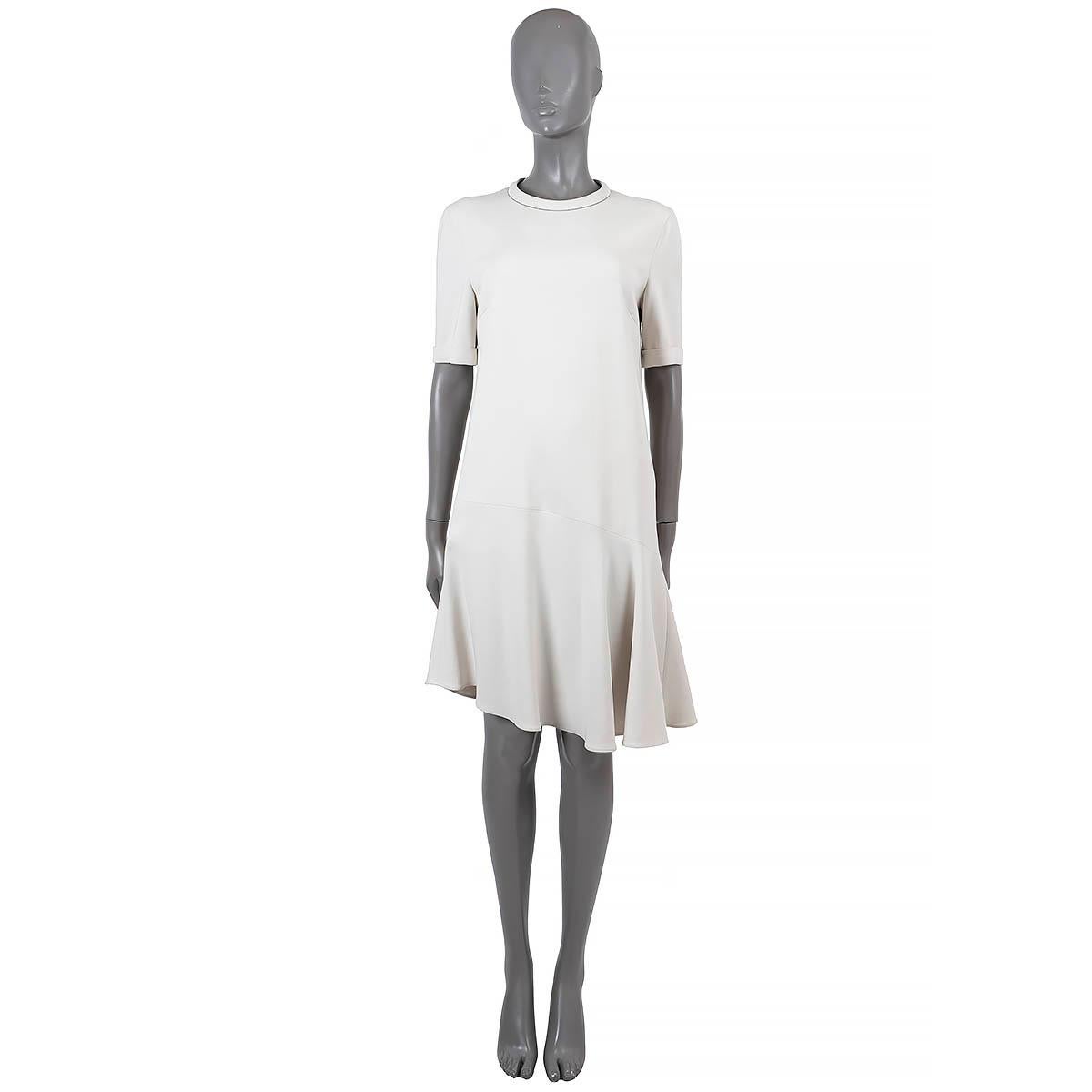 100% authentic Brunello Cucinelli shift dress in ivory wool (53%) and viscose (47%). Features a crewneck with Monili trim, short sleeves and an asymmetric flared hem. Opens with a zipper in the back. Lined in silk (100%). Has been worn and is in