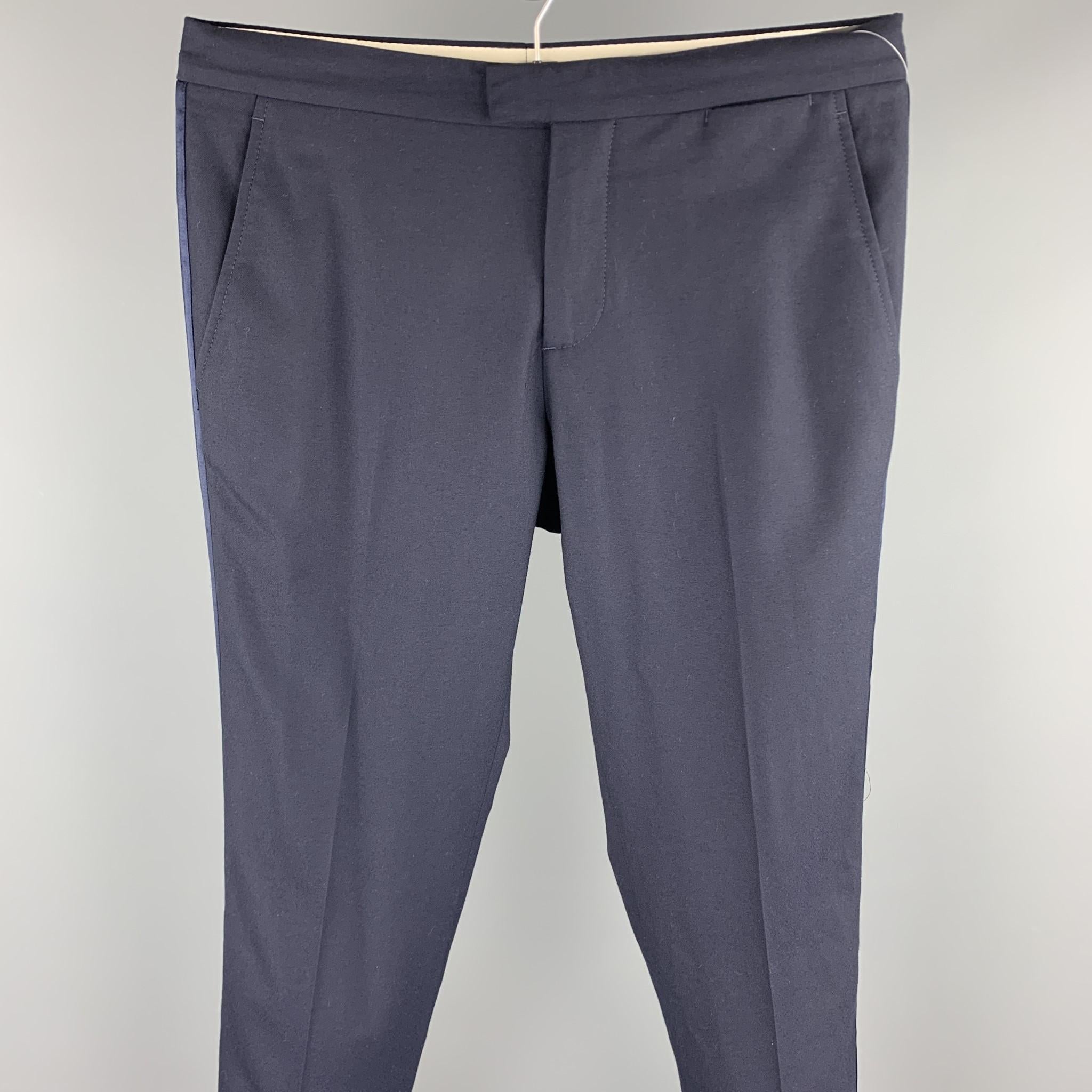 BRUNELLO CUCINELLI dress pants comes in a navy wool featuring a flat front, tuxedo stripe, and a zip fly closure. Made in Italy.

Excellent Pre-Owned Condition.
Marked: IT 48

Measurements:

Waist: 34 in.
Rise: 9 in. 
Inseam: 30 in. 