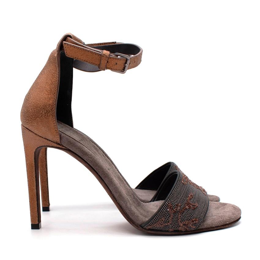 Brunello Cucinelli Embellished Monili Bead Strap Suede Sandals
 

 -Laminated effect
 -Metal applications
 -Sequins
 -Solid colour
 -Ajustable straps
 -Round toe-line
 -Stiletto heel 
 -Leather lining & leather sole
 -Contains non-textile parts of