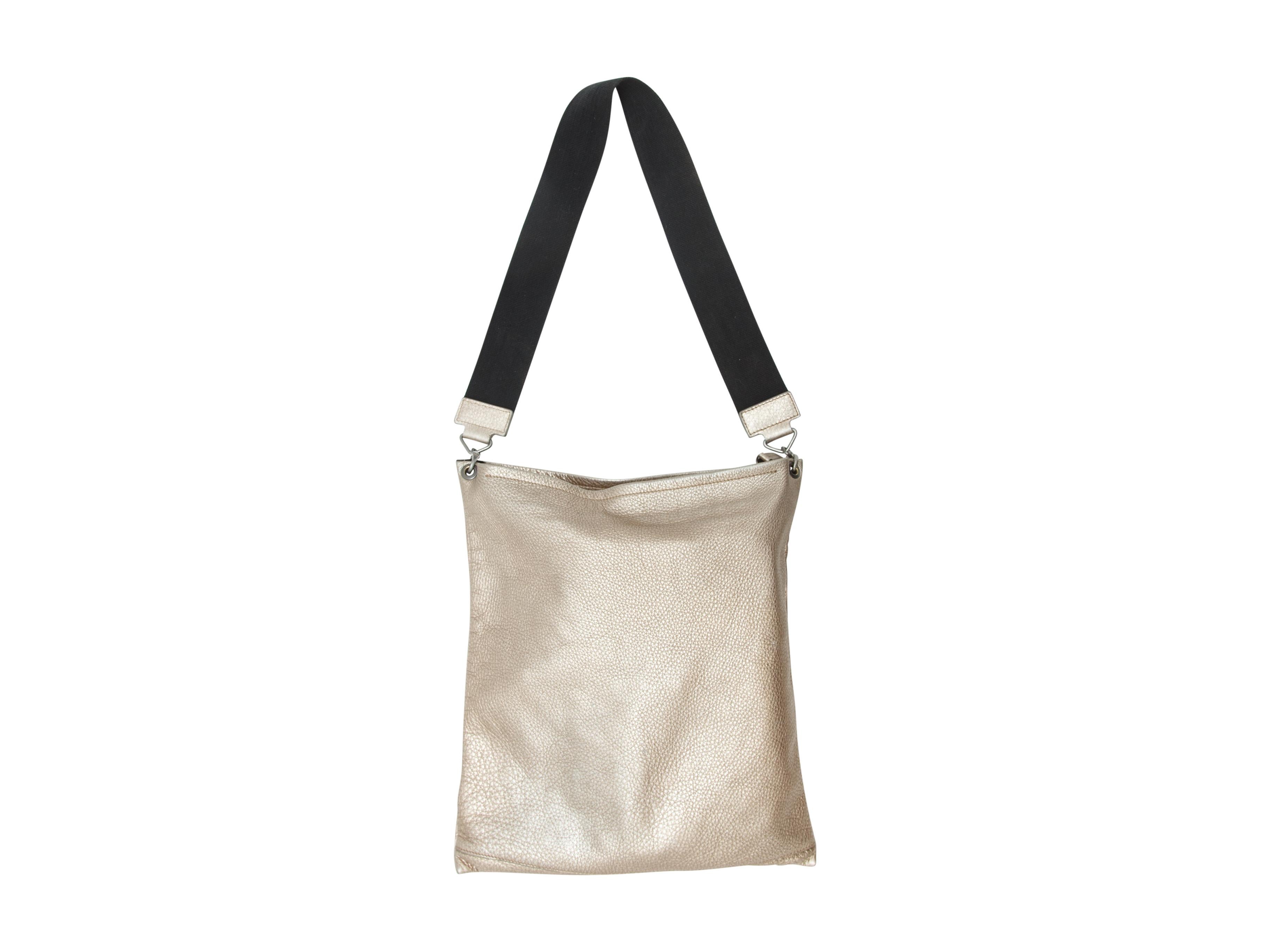 Product details: Gold metallic leather tote bag by Brunello Cucinelli. Silver-tone hardware. Black canvas strap. 14