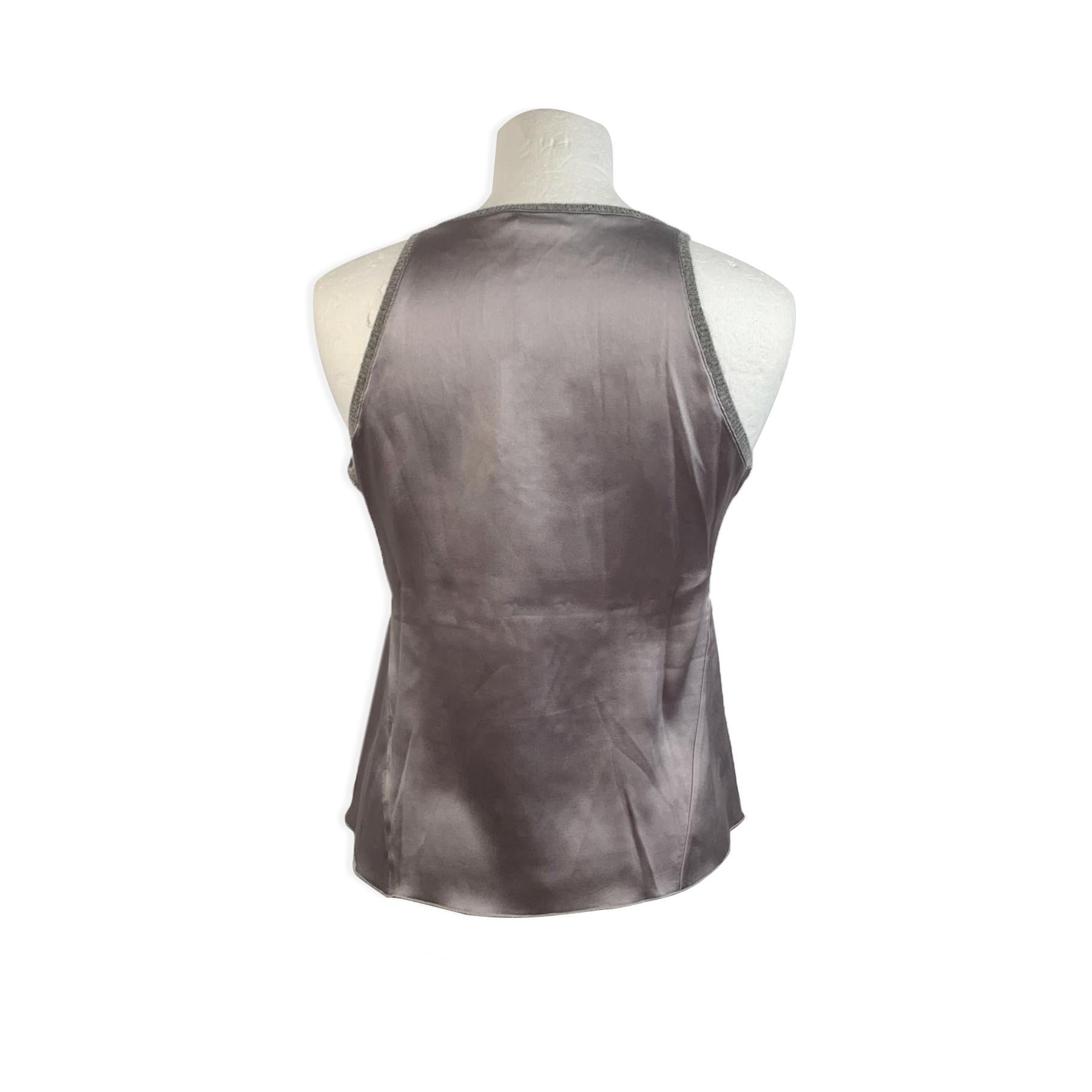 Brunello Cucinelli gray silk tank top. It features a sleeveless styling, a cashmere trim, and a scoop neckline. Composition: 100% Silk, 100% Cashmere. Made in Italy. Size: SMALL.



Details

MATERIAL: Silk

COLOR: Gray

MODEL: Sleeveless