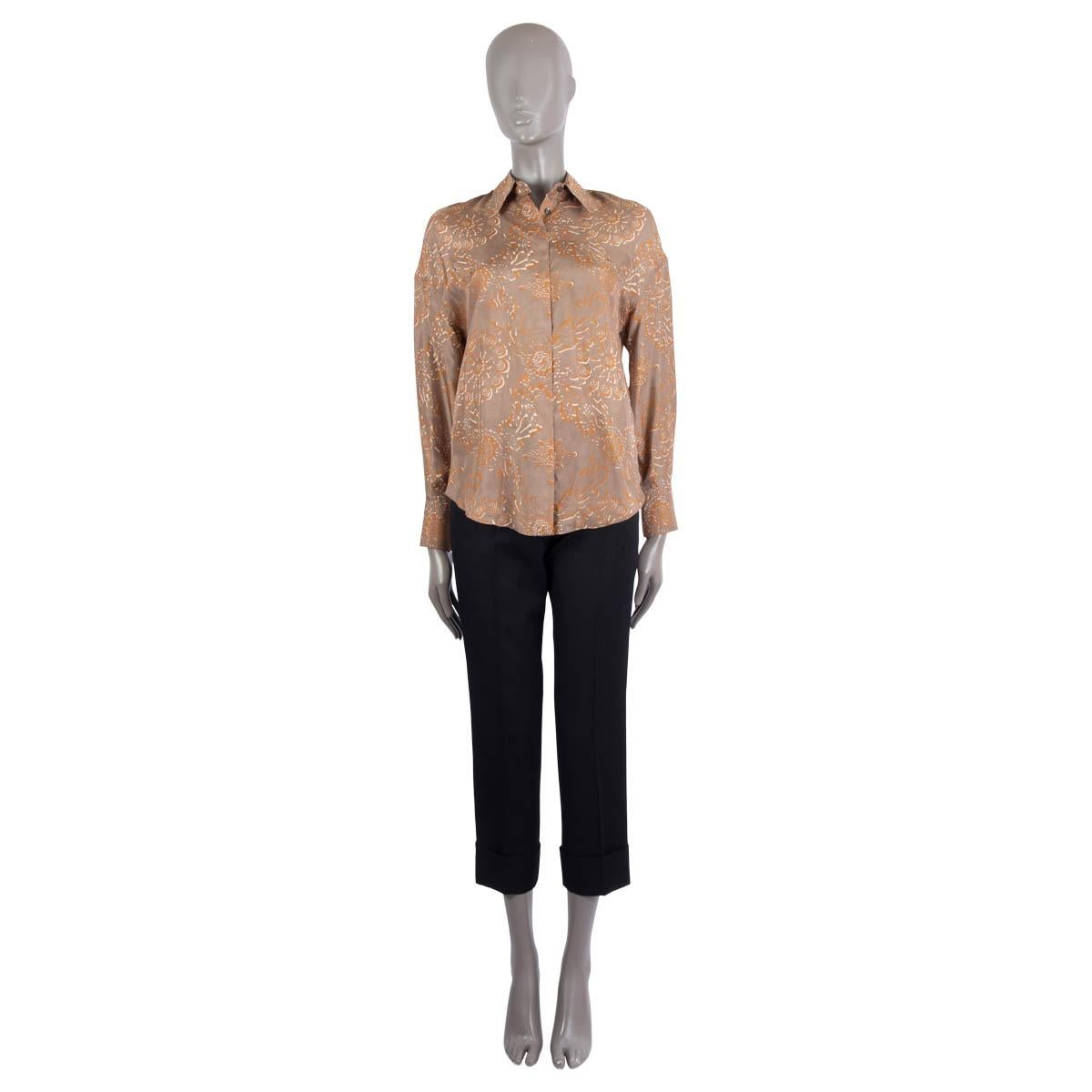 100% authentic Brunello Cucinelli floral silk (100%) shirt in grey, brown and ivory. Closes with concealed front button. Pre-owned - excellent condition.

Measurements
Tag Size	XS
Size	XS
Shoulder Width	50cm (19.5in)
Bust From	102cm (39.8in)
Hips