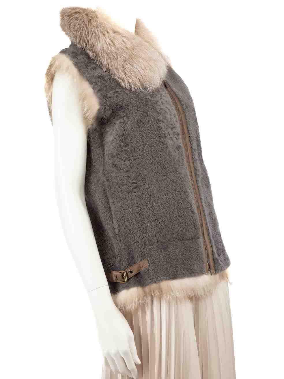 CONDITION is Very good. Hardly any visible wear to jacket is evident on this used Brunello Cucinelli designer resale item.
 
 
 
 Details
 
 
 Grey
 
 Shearling
 
 Gilet
 
 Fur trim
 
 Leather lining
 
 2x Side pockets
 
 Zip fastening
 
 
 
 
 
