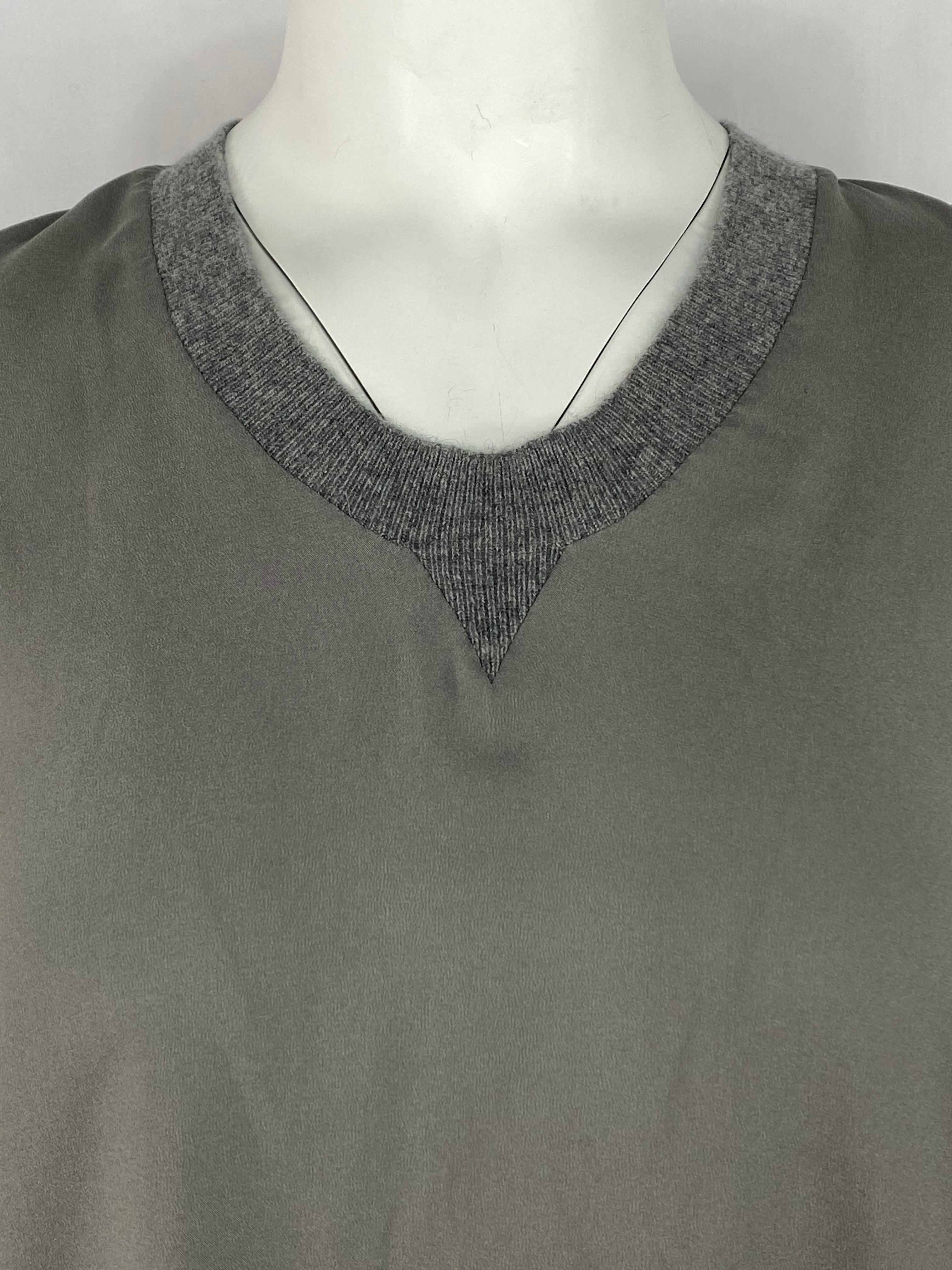 Product details:

Featuring grey, green, olive, silk, crew neck with grey knit detail, sleeveless, asymmetrical style. The shorter side measures 29