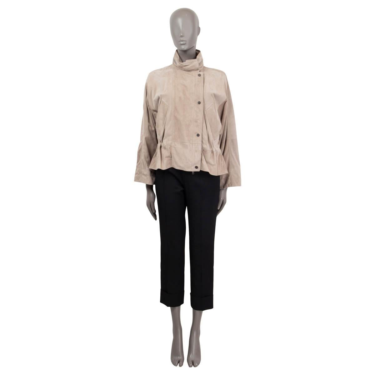 100% authentic Brunello Cucinelli oversized stand collar jacket in light taupe suede (100%). Features Monili striped details along the collar, a hidden hood, two buttoned slit pockets and long raglan sleeves (sleeve measurements taken from the