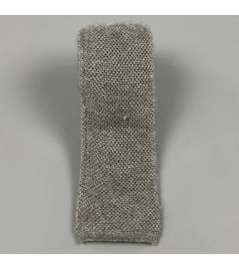 BRUNELLO CUCINELLI necktie comes in a grey textured cashmere / silk. Made in Italy.
 Very Good
 Pre-Owned Condition. 
 

 Measurements: 
  Width: 2.25 inches 
  
  
  
 Sui Generis Reference: 115752
 Category: Tie
 More Details
  
 Brand: BRUNELLO