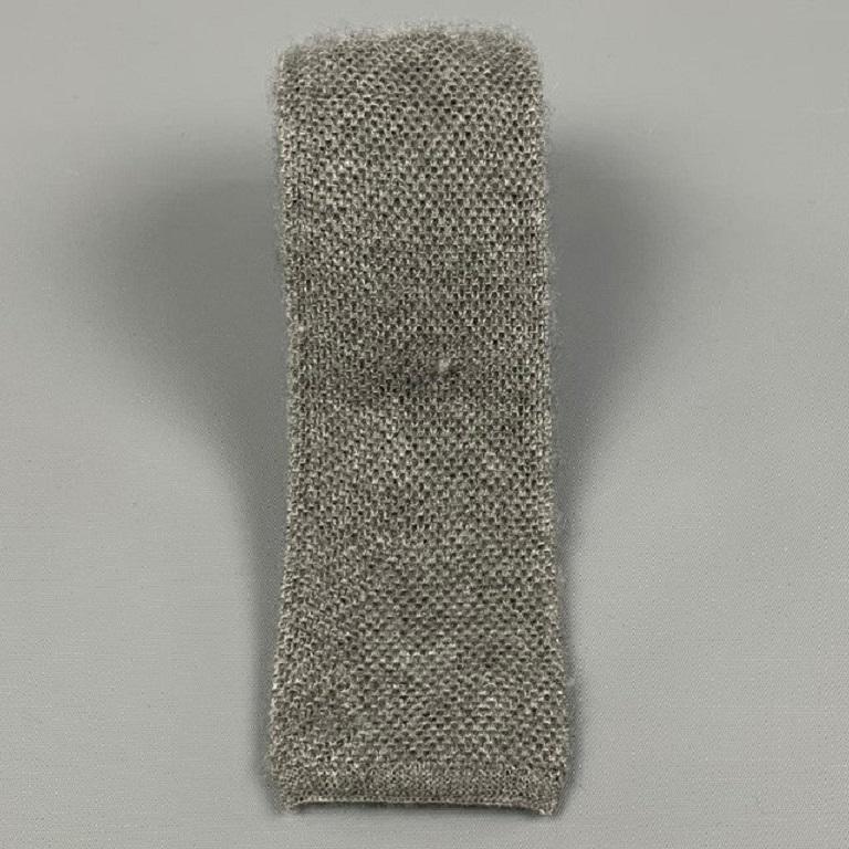 BRUNELLO CUCINELLI necktie comes in a grey textured cashmere / silk. Made in Italy.
Very Good
Pre-Owned Condition. 

Measurements: 
  Width: 2.25 inches 
  
  
 
Reference: 115752
Category: Tie
More Details
    
Brand:  BRUNELLO CUCINELLI
Color: 